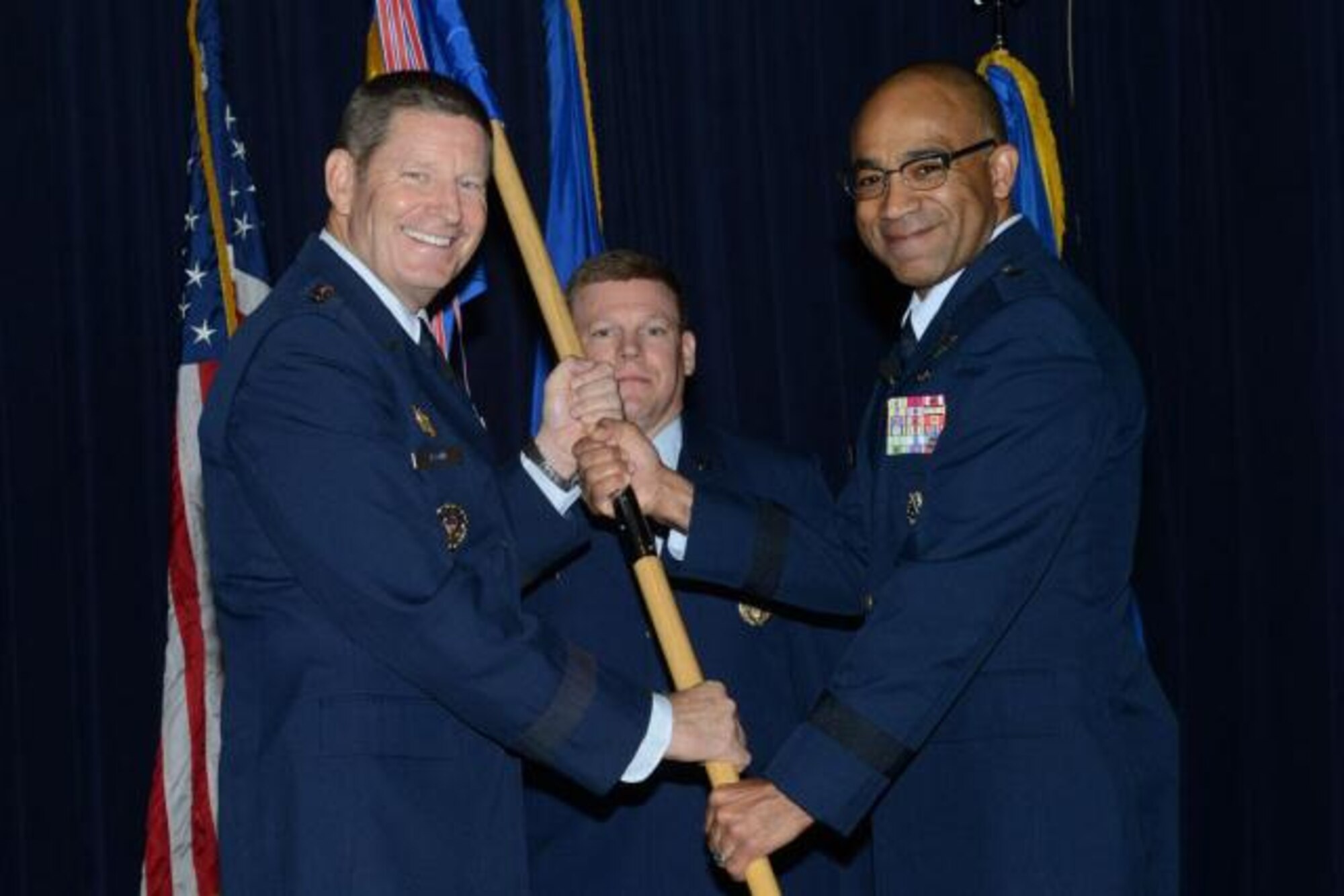 Brig. Gen. James C. Johnson (right) assumed command of the Air Force Recruiting Service in a ceremony at Joint Base San Antonio-Randolph-Texas, Sept. 11. General Robin Rand, commander of Air Education and Training Command (left), presided over the ceremony. (U.S. Air Force photo)