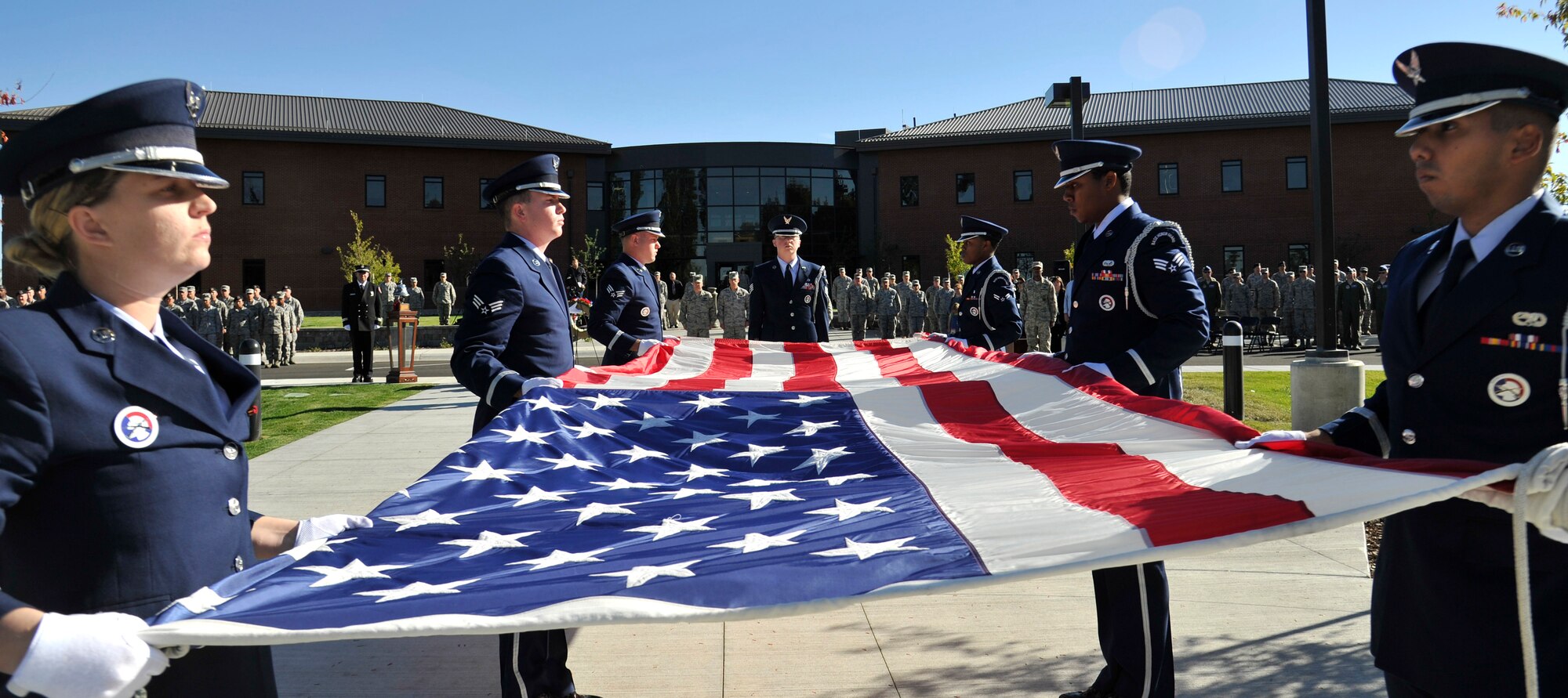 Members of Team Fairchild’s base Honor Guard perform a six man flag fold during the Sept. 11 retreat ceremony at Fairchild Air Force Base, Washington, Sept. 11, 2014. Members of Team Fairchild assembled in front of the 92nd Air Refueling Wing Headquarters for a formal retreat ceremony marking the 13th anniversary of Sept. 11th attacks. (U.S. Air Force photo by Senior Airman Ryan Zeski/Released)