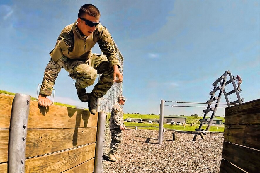 Senior Airman Jeffrey Gebhardt, 446th Force Support Squadron client systems technician, out of Joint Base Lewis-McChord, Washington, bounds one of the numerous obstacles at Warrior Spirit, Aug. 18, 2014 at MacDill Air Force Base, Florida. Gebhardt has been assigned to the Joint Communications Support Element at MacDill since November 2013, and is on long-term orders to continue his needed support. Warrior Spirit is a weeklong team-based exercise built to validate technical and tactical skills while creating unit cohesion. (U.S. Army photo by Spc. Andrew Sveen)