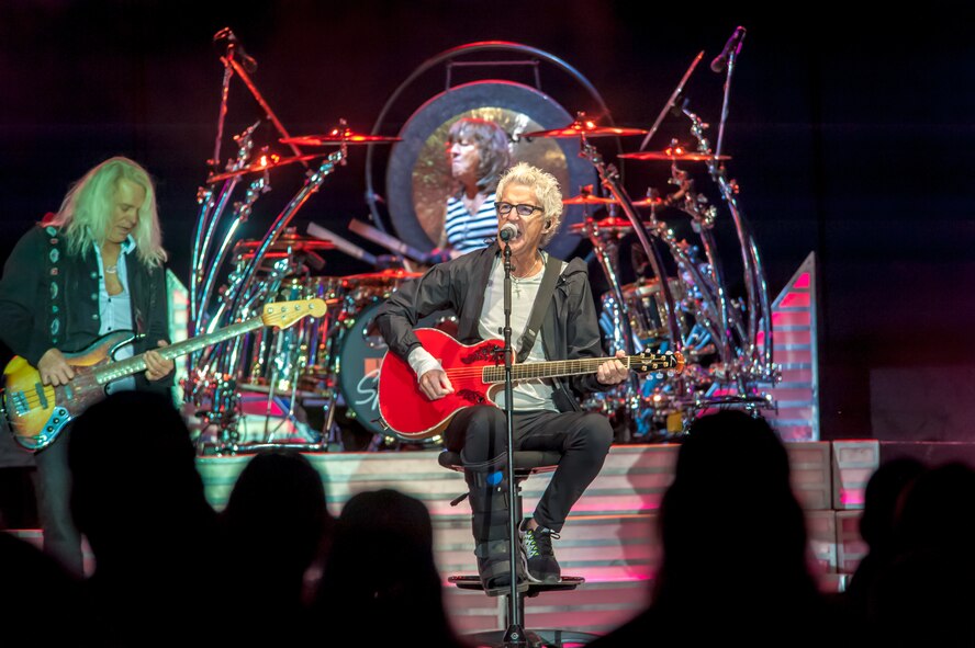 Kevin Cronin, REO Speedwagon lead vocalist and rhythm guitarist, sings to an audience including America’s veterans as Bruce Hall, the band’s bass guitarist and harmony vocalist, and Bryan Hitt, REO’s percussion and drummer, keep the rhythm during a Grandstand performance at the Spokane Interstate Fair in Spokane, Washington, Sept. 11, 2014. REO Speedwagon thanked America’s veterans and families, both past and present, for their service and sacrifice in the name of freedom. Total force Airmen from around the globe took time to commemorate the 13th anniversary of Sept. 11, 2001, with everything from commemorative runs, to tributes and moments of silence. (U.S. Air Force photo/Staff Sgt. Benjamin W. Stratton) 

