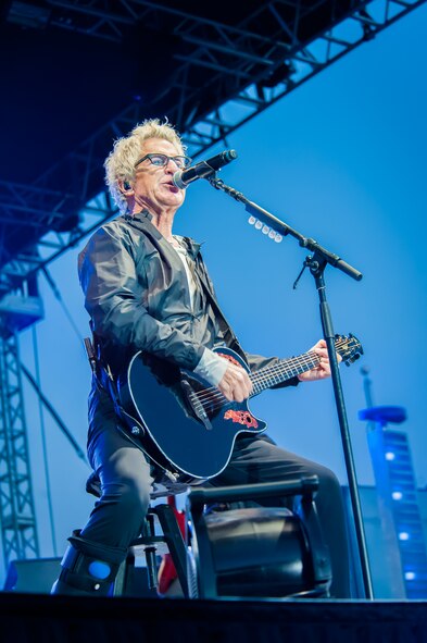 Kevin Cronin, REO Speedwagon lead vocalist and rhythm guitarist, jams out on his guitar to the Spokane community including America's veterans during a Grandstand performance at the Spokane Interstate Fair in Spokane, Washington, Sept. 11, 2014. REO Speedwagon thanked America’s veterans and families, both past and present, for their service and sacrifice in the name of freedom. Total force Airmen from around the globe took time to commemorate the 13th anniversary of Sept. 11, 2001, with everything from commemorative runs, to tributes and moments of silence. (U.S. Air Force photo/Staff Sgt. Benjamin W. Stratton)