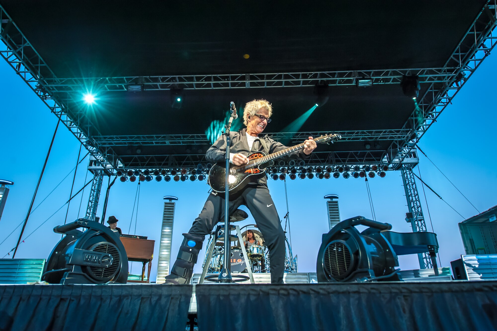 Kevin Cronin, the REO Speedwagon lead vocalist and rhythm guitarist, jams out on his guitar to the Spokane community including America's veterans during a Grandstand performance at the Spokane Interstate Fair in Spokane, Washington, Sept. 11, 2014. REO Speedwagon thanked America’s veterans and families, both past and present, for their service and sacrifice in the name of freedom. Total force Airmen from around the globe took time to commemorate the 13th anniversary of Sept. 11, 2001, with everything from commemorative runs, to tributes and moments of silence. (U.S. Air Force photo by Staff Sgt. Benjamin W. Stratton/Released)