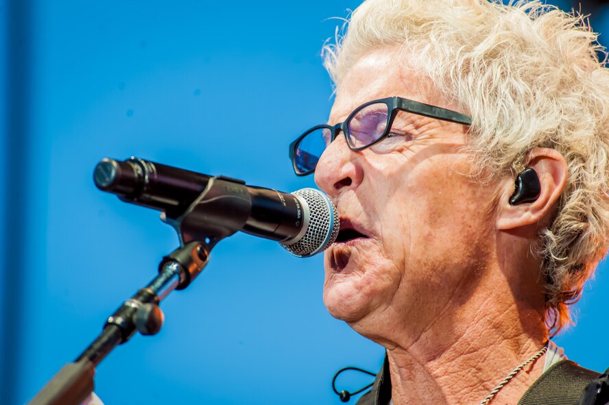 Kevin Cronin, the REO Speedwagon lead vocalist and rhythm guitarist, sings to the Spokane community including America's veterans during a Grandstand performance at the Spokane Interstate Fair in Spokane, Washington, Sept. 11, 2014. REO Speedwagon thanked America’s veterans and families, both past and present, for their service and sacrifice in the name of freedom. Total force Airmen from around the globe took time to commemorate the 13th anniversary of Sept. 11, 2001, with everything from commemorative runs, to tributes and moments of silence. (U.S. Air Force photo/Staff Sgt. Benjamin W. Stratton)