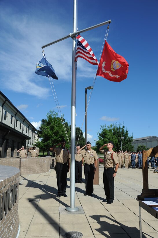 Members of the Center for Naval Aviation Technical Training Unit Keesler render a salute during a remembrance ceremony Sept. 11, 2014, Keesler Air Force Base, Miss. The ceremony honored those who lost their lives during the 9/11 attacks. (U.S. Air Force photo by Kemberly Groue)