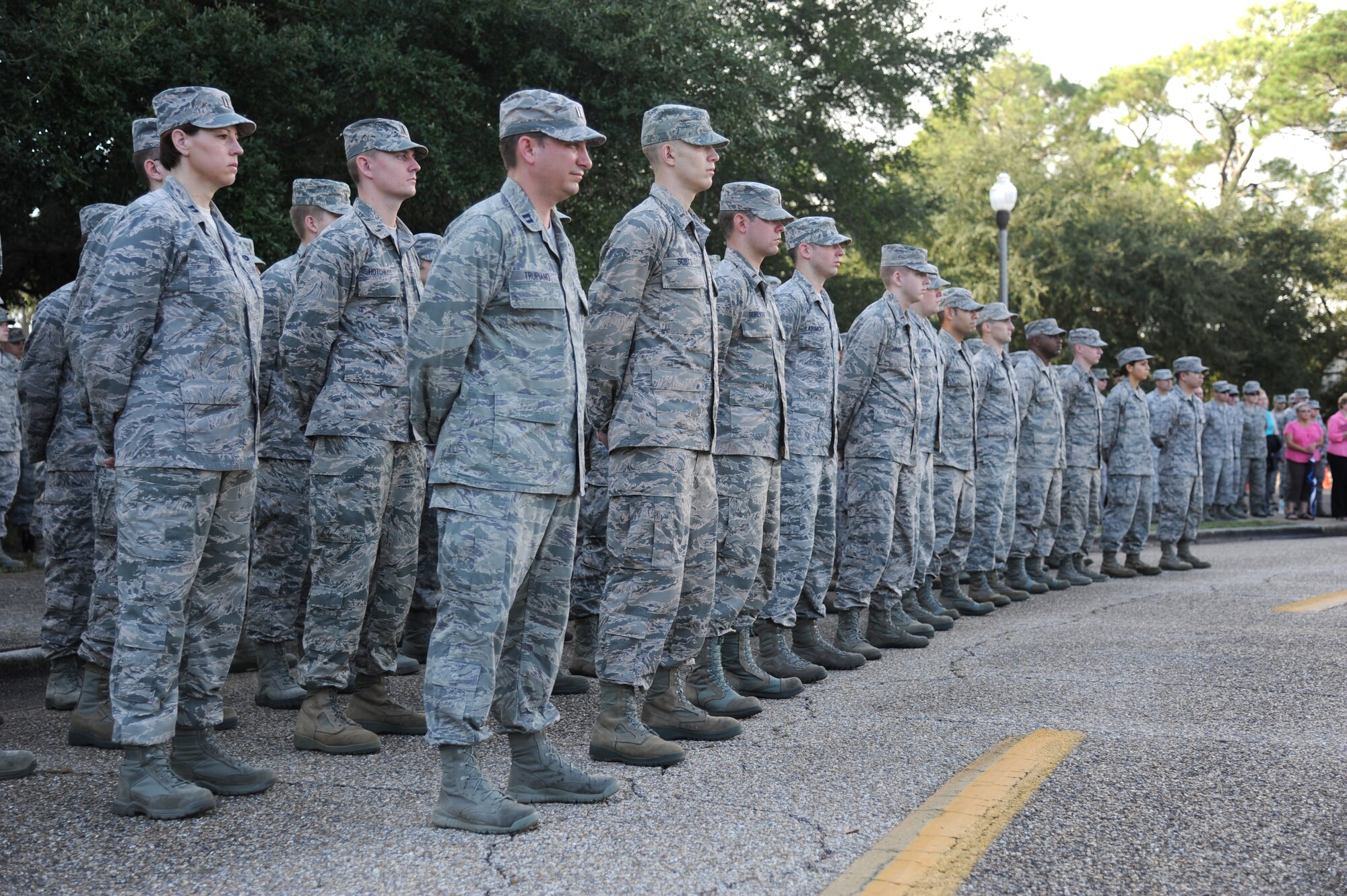 Keesler personnel stand at parade rest during a remembrance ceremony Sept. 11, 2014, Keesler Air Force Base, Miss. The ceremony honored those who lost their lives during the 9/11 attacks.  (U.S. Air Force photo by Kemberly Groue)