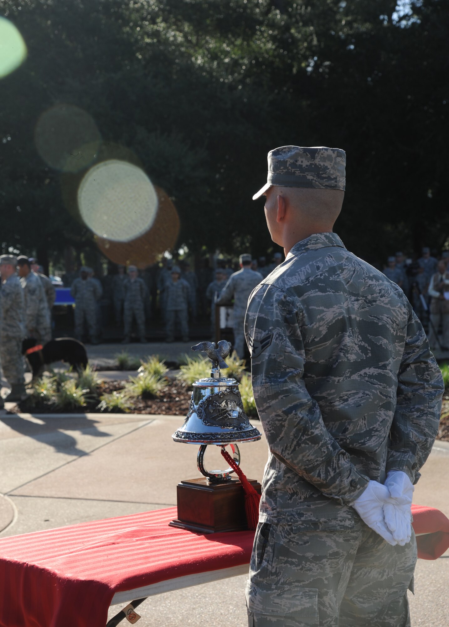 Airman 1st Class Tyler Fisher, Keesler firefighter, stands at attention in preparation to conduct a final bell tribute during a remembrance ceremony Sept. 11, 2014, Keesler Air Force Base, Miss. The ceremony honored those who lost their lives during the 9/11 attacks.  (U.S. Air Force photo by Kemberly Groue)