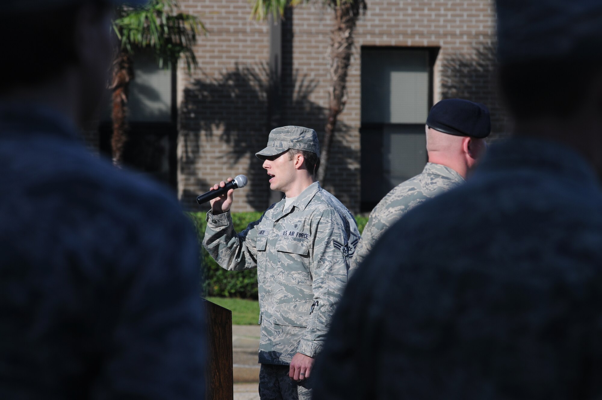 Senior Airman Robert Desantis, 81st Medical Group, sings “God Bless America” during a remembrance ceremony Sept. 11, 2014, Keesler Air Force Base, Miss. The ceremony honored those who lost their lives during the 9/11 attacks.  (U.S. Air Force photo by Kemberly Groue)