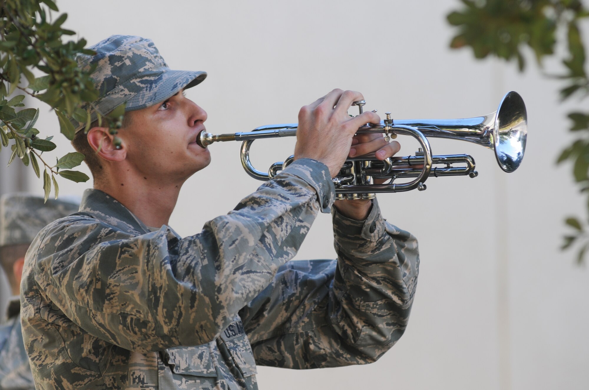 Airman Basic Quentin Stover, 338th Training Squadron and member of the Keesler Drum and Bugle Corps, plays taps during a remembrance ceremony Sept. 11, 2014, Keesler Air Force Base, Miss. The ceremony honored those who lost their lives during the 9/11 attacks.  (U.S. Air Force photo by Kemberly Groue)