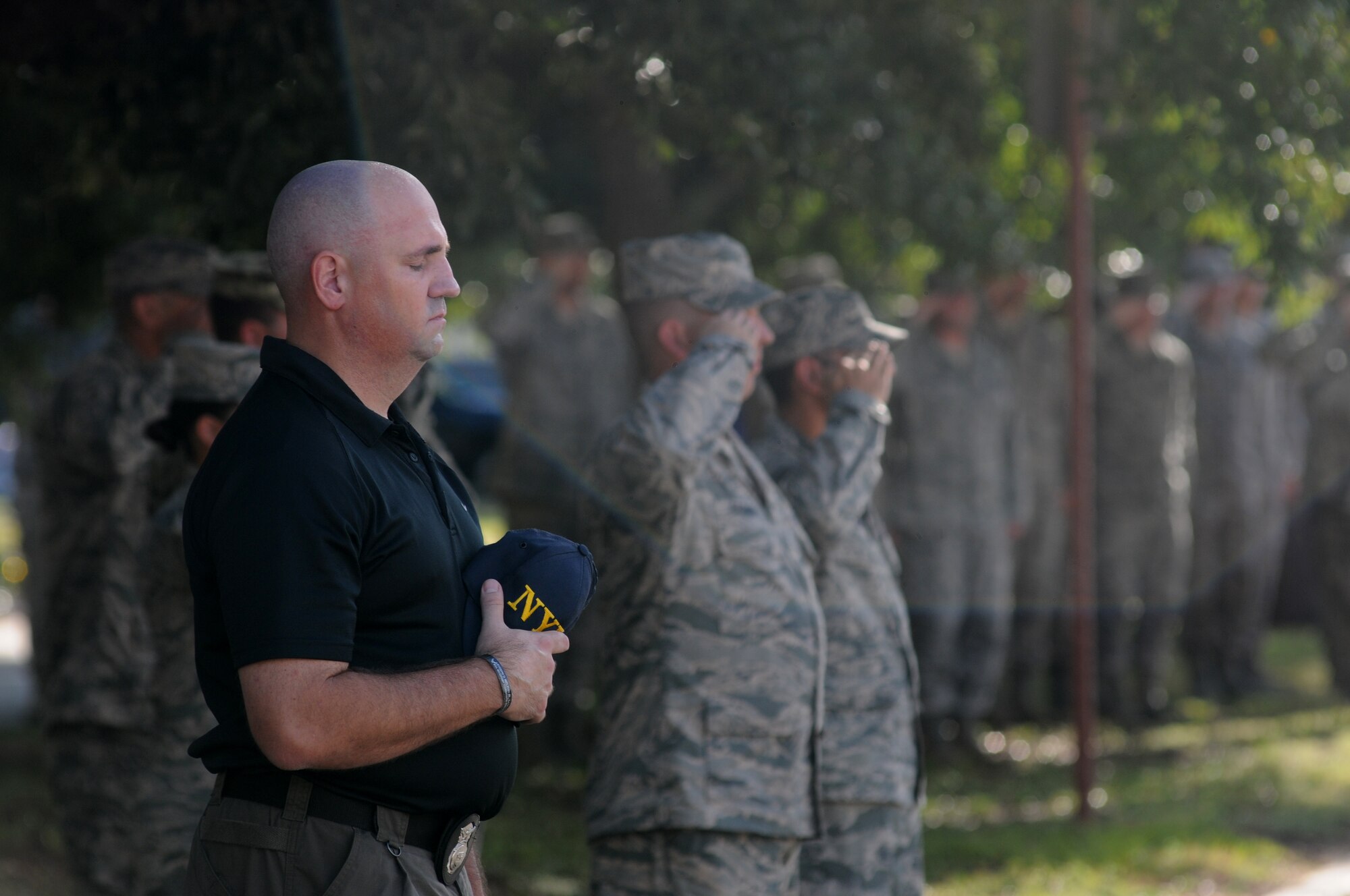 Tech. Sgt. Douglas Wickline, 81st Security Forces Squadron, closes his eyes as taps is played during a remembrance ceremony Sept. 11, 2014, Keesler Air Force Base, Miss. The ceremony honored those who lost their lives during the 9/11 attacks.  (U.S. Air Force photo by Kemberly Groue)