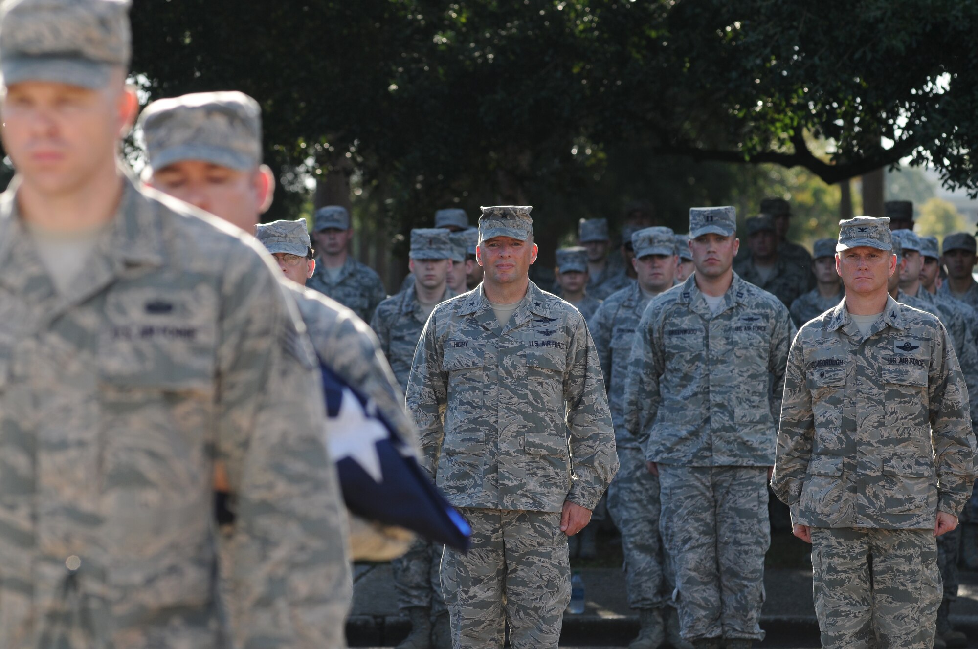 Brig. Gen. Patrick Higby, 81st Training Wing commander, and Col. Dennis Scarborough, 81st TRW vice commander, stand among Keesler personnel during a remembrance ceremony Sept. 11, 2014, Keesler Air Force Base, Miss. The ceremony honored those who lost their lives during the 9/11 attacks.  (U.S. Air Force photo by Kemberly Groue)