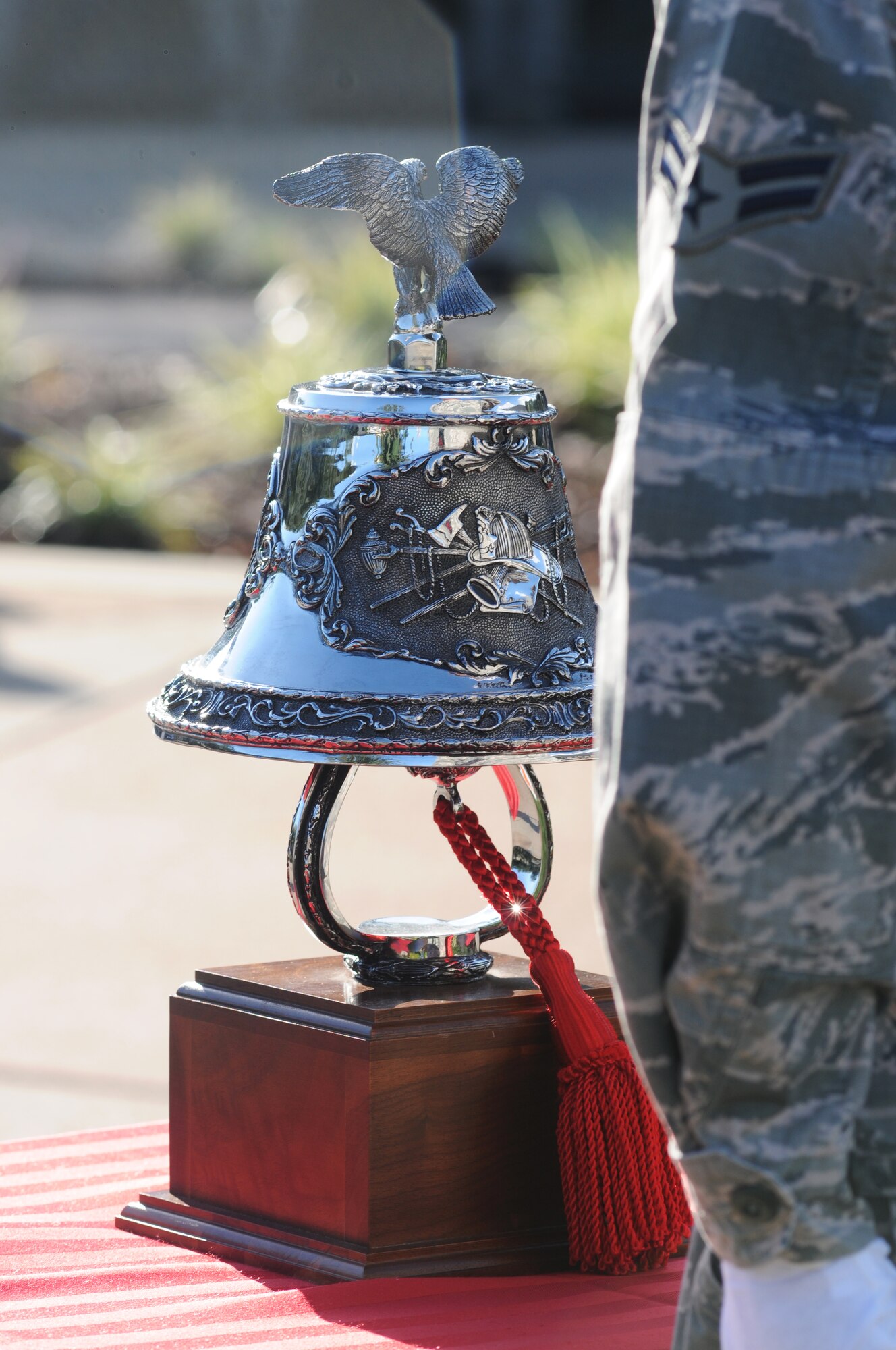 Airman 1st Class Tyler Fisher, Keesler firefighter, stands at attention in preparation to conduct a final bell tribute during a remembrance ceremony Sept. 11, 2014, Keesler Air Force Base, Miss. The ceremony honored those who lost their lives during the 9/11 attacks.  (U.S. Air Force photo by Kemberly Groue)