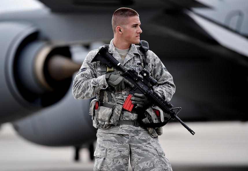 Airman 1st Class Eric Windler, 22nd Security Forces Squadron entry controller, patrols the flightline during a base exercise Sept. 10, 2014, at McConnell Air Force Base, Kan. He is trained to cease and apprehend all unauthorized personnel who enter restricted areas on the flightline. (U.S. Air Force photo/Airman 1st Class John Linzmeier)