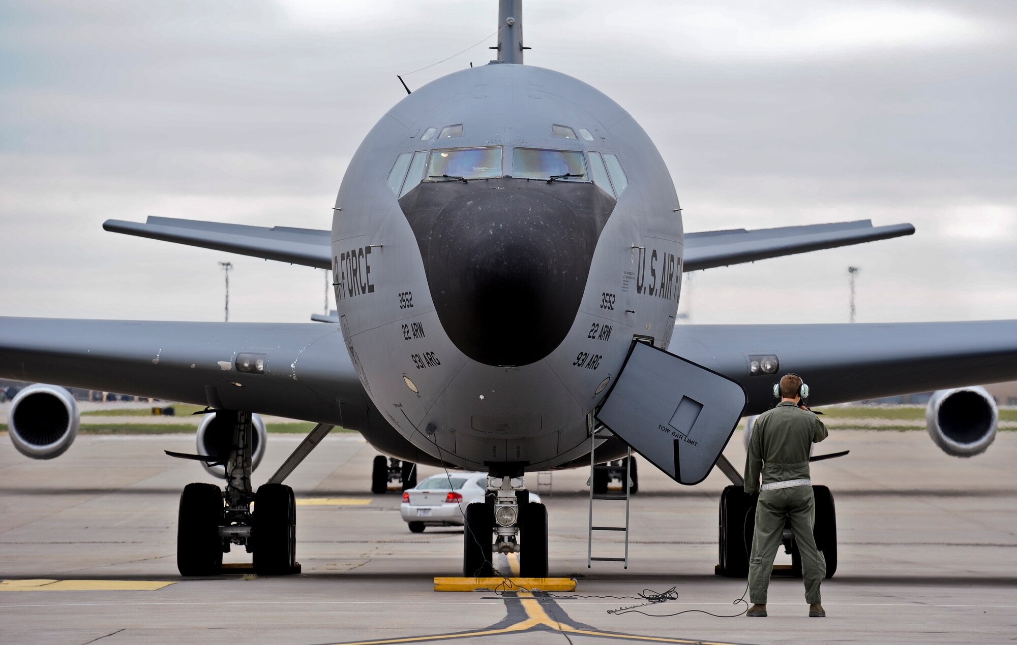 A maintenance Airman communicates with aircrew inside a KC-135R Stratotanker before takeoff, Sept. 10, 2014, at McConnell Air Force Base, Kan. Several aircraft were sent out on short notice during an exercise to test mission readiness. (U.S. Air Force photo/Airman 1st Class John Linzmeier)