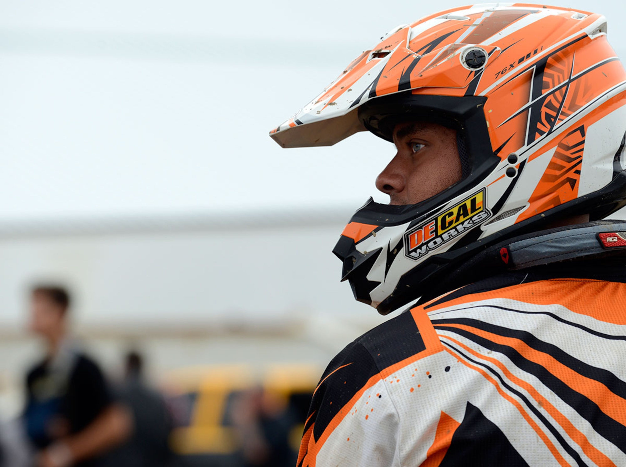 Army Sgt. Jeremy Hazard, 84th Engineer Support Company wheel vehicle mechanic, watch other bikers compete while waiting for his turn during the 7th Annual Alaska Supercross Challenge at the Alaska State Fair in Palmer, Alaska, August 23, 2014. (U.S. Air Force photo/Staff Sgt. Sheila deVera) 