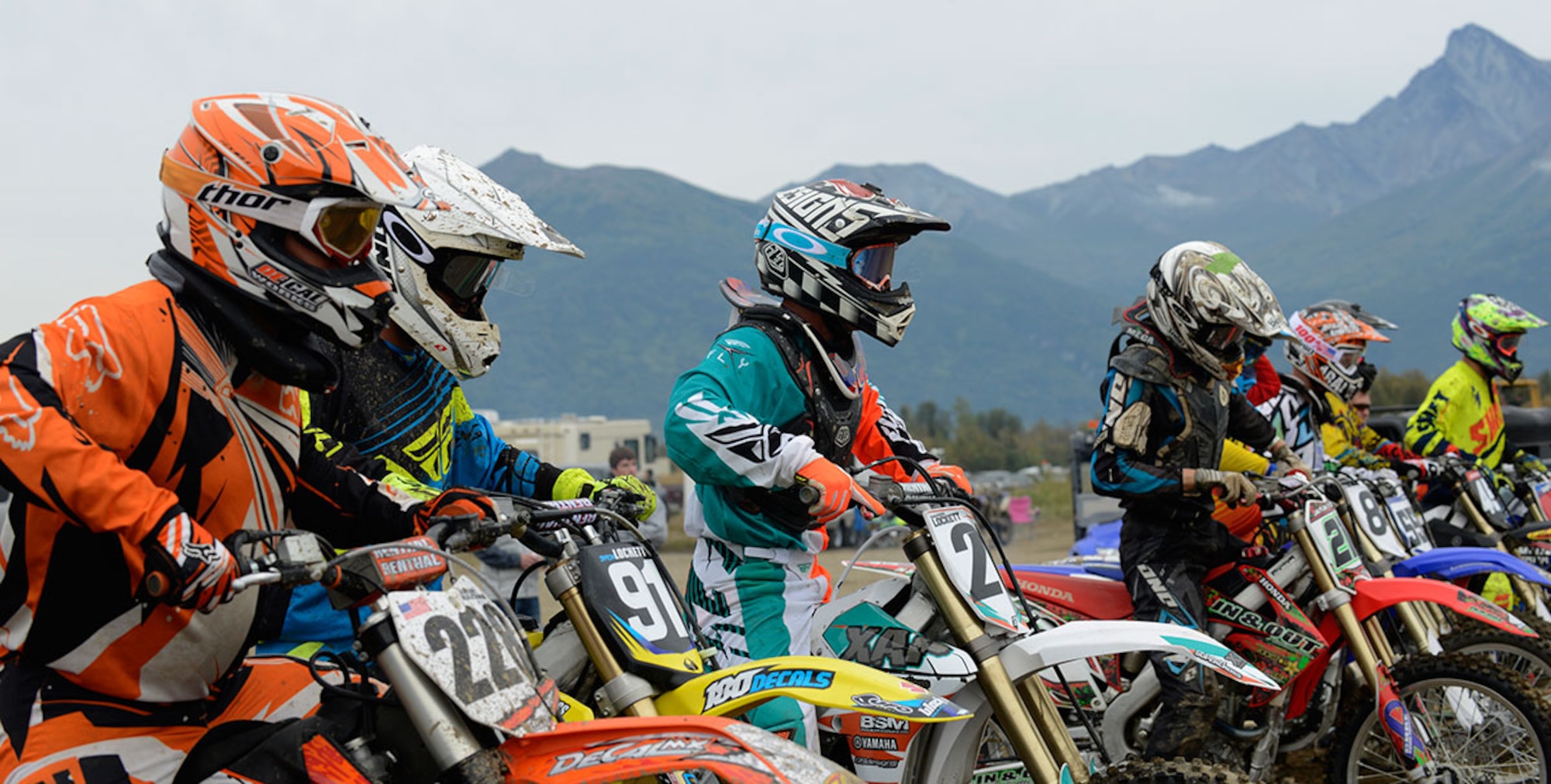 Army Sgt. Jeremy Hazard and other competitors wait for the signal to start just before a race at the fairgrounds in Palmer, Alaska, Aug. 23, 2014. Hazard is a wheeled vehicle mechanic with the 84th Engineer Support Company and works on Joint Base Elmendorf-Richardson. Motocross racing has been one of his dreams since he was a child, and he plans to continue racing his bike after he moves to a new duty station next year. He plans to return to Alaska to compete in the state fair. (U.S. Air Force photo/Staff Sgt. Sheila deVera)