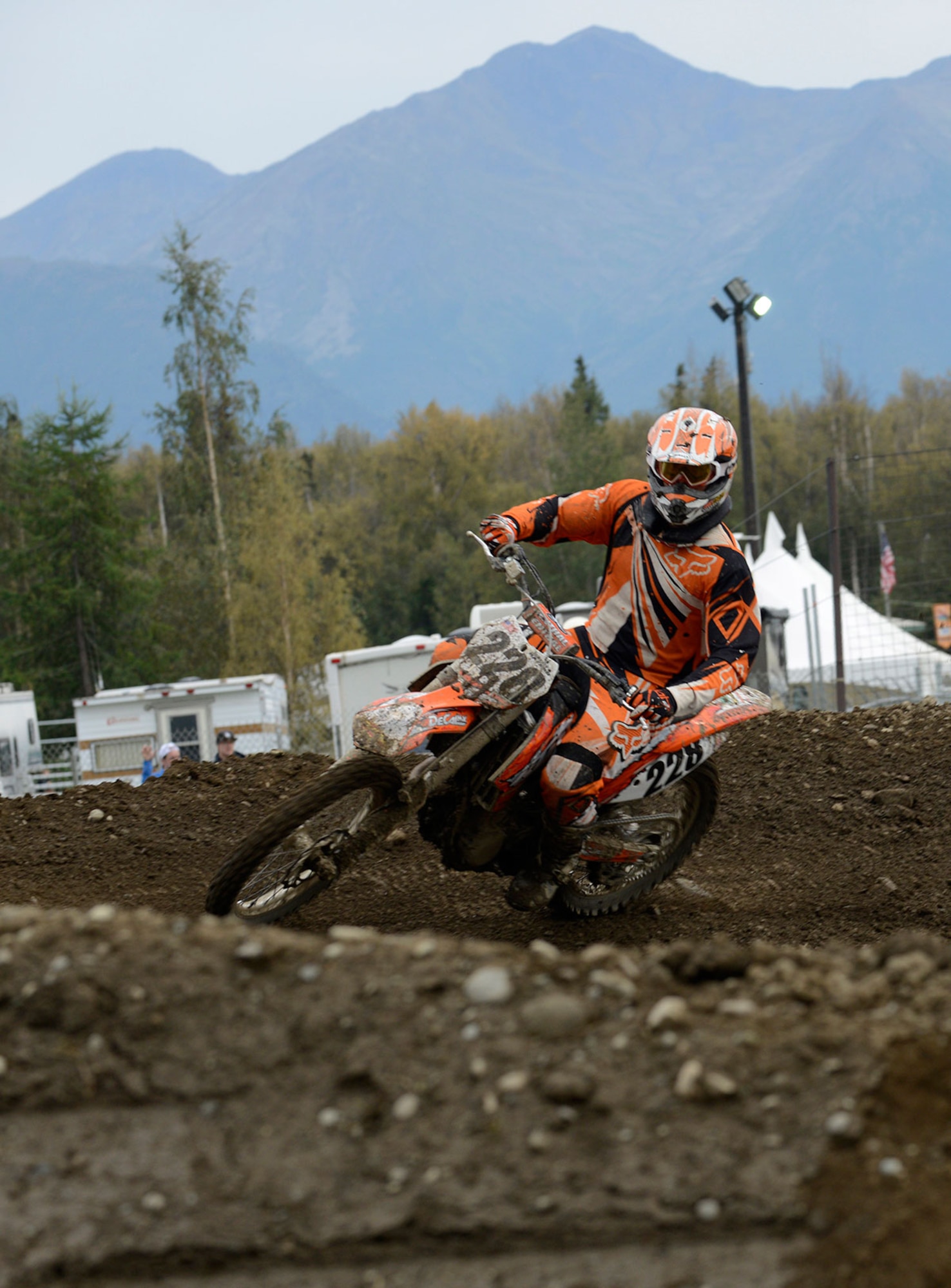 Army Sgt. Jeremy Hazard, 84th Engineer Support Company wheel vehicle mechanic, rides through the track on his dirt bike during the 7th Annual Alaska Supercross Challenge at the Alaska State Fair in Palmer, Alaska, August 23, 2014. Since the age of seven, Hazard has always wanted to feel what the riders were experiencing during the race. (U.S. Air Force photo/Staff Sgt. Sheila deVera)