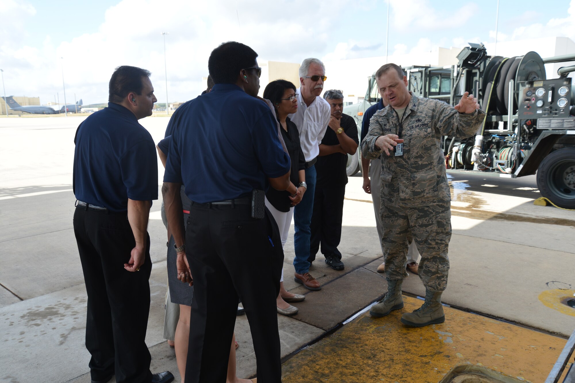 Col. Craig Petersen, 433rd Mission Support Squadron Commander, Joint Base San Antonio-Lackland, Texas describes the process of refueling the C-5A Galaxy on the flightline to honorary commanders, during a tour of the 433rd Mission Support Group, Sept. 6, 2014  (U.S. Air Force photo/Minnie Jones)