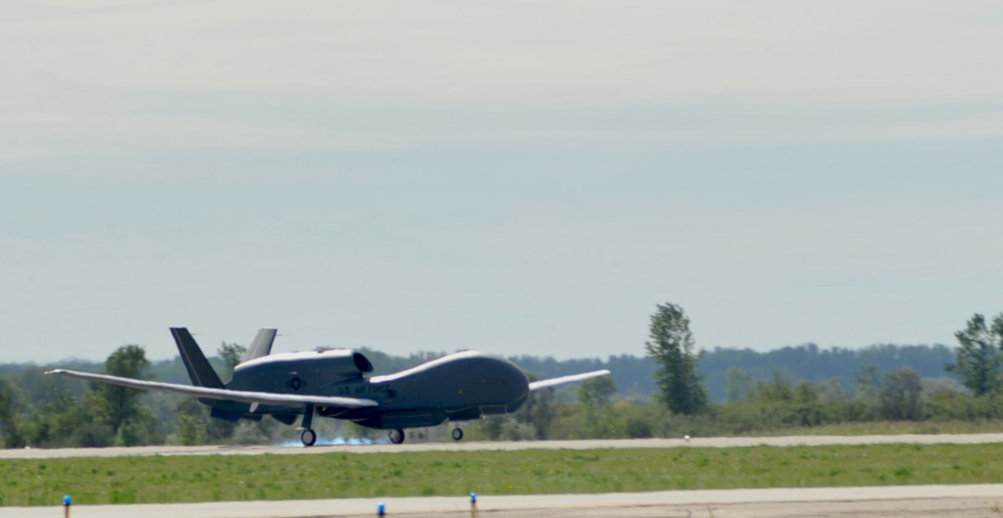 The last RQ-4 Block 40 Global Hawk expected to be delivered to the Air Force touches down at Grand Forks Air Force Base, N.D., Sept. 10, 2014. The Block 40 has flown more than 100 combat support missions since it was added to the Air Force stable of aircraft. (U.S. Air Force photo/Airman 1st Class Bonnie Grantham)