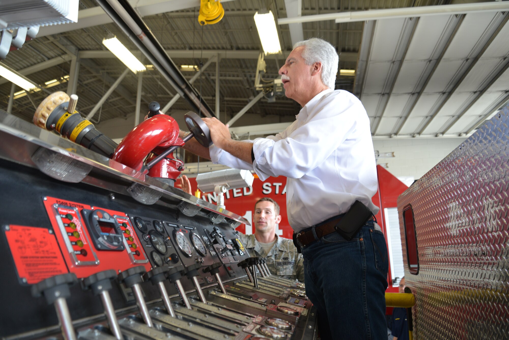 433rd Airlift Wing Honorary Commander, Dave Saylor, owner, Acadiana Café, San Antonio, studies a fire engine’s pump panel that is used to control fire hoses. “Alamo Wing” Honorary commanders received a tour of the 433rd Mission Support Group, Sept. 6, 2014 at Joint Base San Antonio, Texas. (U.S. Air Force photo/Minnie Jones)

