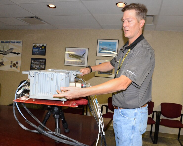 Colin Tatham, the KC-135 acting electric/avionics unit chief with the 564th Aircraft Maintenance Squadron, displays a “fly table,” which helps people in the 10th Flight Test Squadron who perform pre-flight testing to see if there are any problems with the KC-135’s auto-pilot function and is also being used on all other aircraft at Tinker Air Force Base. The fly table came to fruition through a joint effort by members of sheetmetal, quality assurance, engineering and transformation offices, as well as many others. Approximately $43,000 per flight is saved by using this simple innovation before an aircraft even takes off. (Air Force photo by Kelly White)