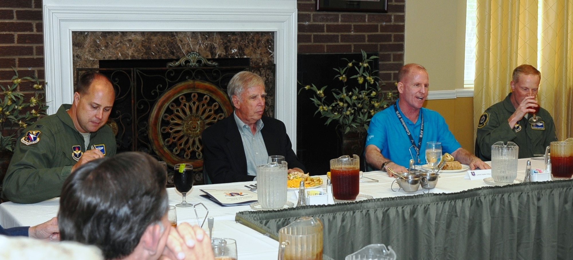 Maj. Gen. Stephen Wilson, Commander, Air Force Global Strike Command(blue shirt), leads a conversation with Col. John Nichols, 14th Flying Training Wing Commander, retired Gen. Doc Foglesong, former 14th FTW commander, and Col. Howard McArthur, 14th FTW vice commander, at the Wingman Luncheon Thursday, Sept. 4, at the Columbus AFB Club.  Seventeen Wingmen and nine former wing and vice wing commanders attended the Heritage to Horizons Wingman Luncheon. (U.S. Air Force Photo/Airman John Day)