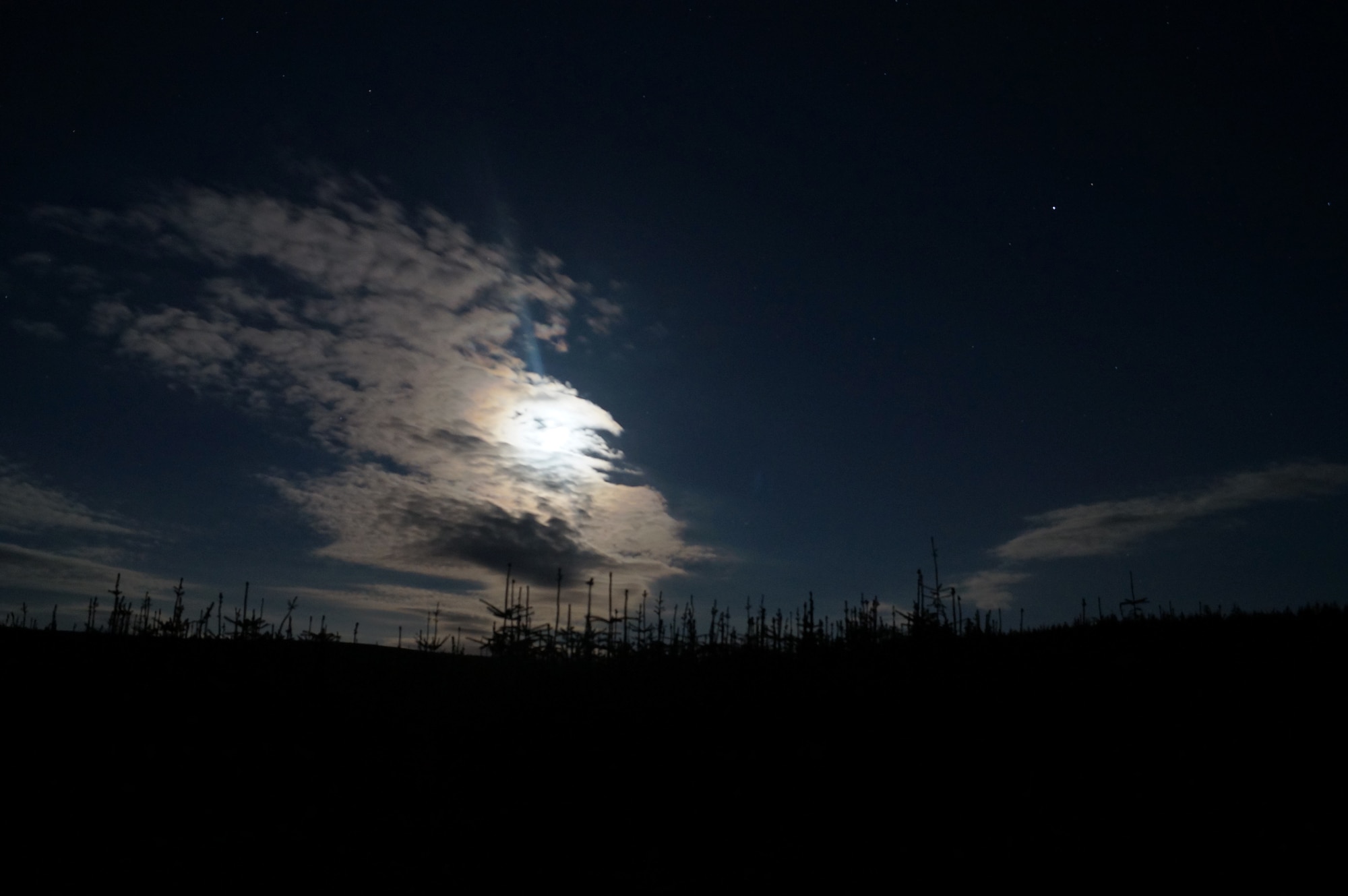 Light from the moon shines through clouds outside the Kielder Observatory, Sept. 7, 2014. The observatory is located in England’s only International Dark Sky park and offers a variety of events and workshops open to the public. (U.S. Air Force photo by Tech. Sgt. Eric Burks/Released)