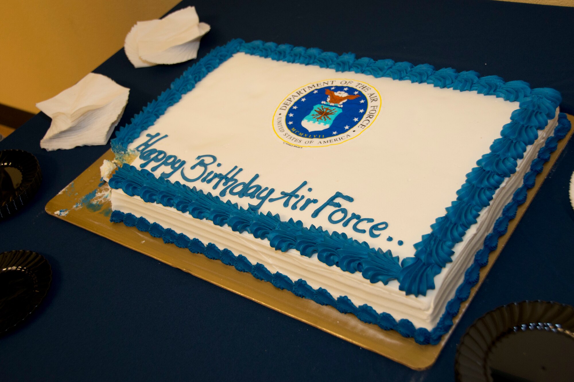 On Sept. 18, 1947 the United States Air Force was established. In order to continue a strong Heritage and to celebrate the Air Force's 67th birthday, the Wing tracked down the youngest available Airman currently on Homestead Air Reserve Base, Fla., to cut and receive the first slice of birthday cake at the Community Activity Center, 7 Sept. (U.S. Air Force photo by Senior Airman Nicholas Caceres)
