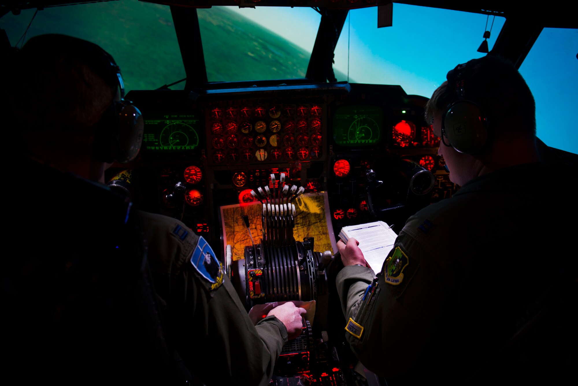 Capts. Will Hacker and Britt Nemeth, pilots from the 69th Bomb Squadron, use the Weapons System Trainer at Minot Air Force Base, N.D., Sept. 9, 2014. Hacker and Nemeth practiced flying in the B-52 Stratofortress simulator to prepare for this year’s Global Strike Challenge. (U.S. Air Force photo/Airman 1st Class Sahara L. Fales)