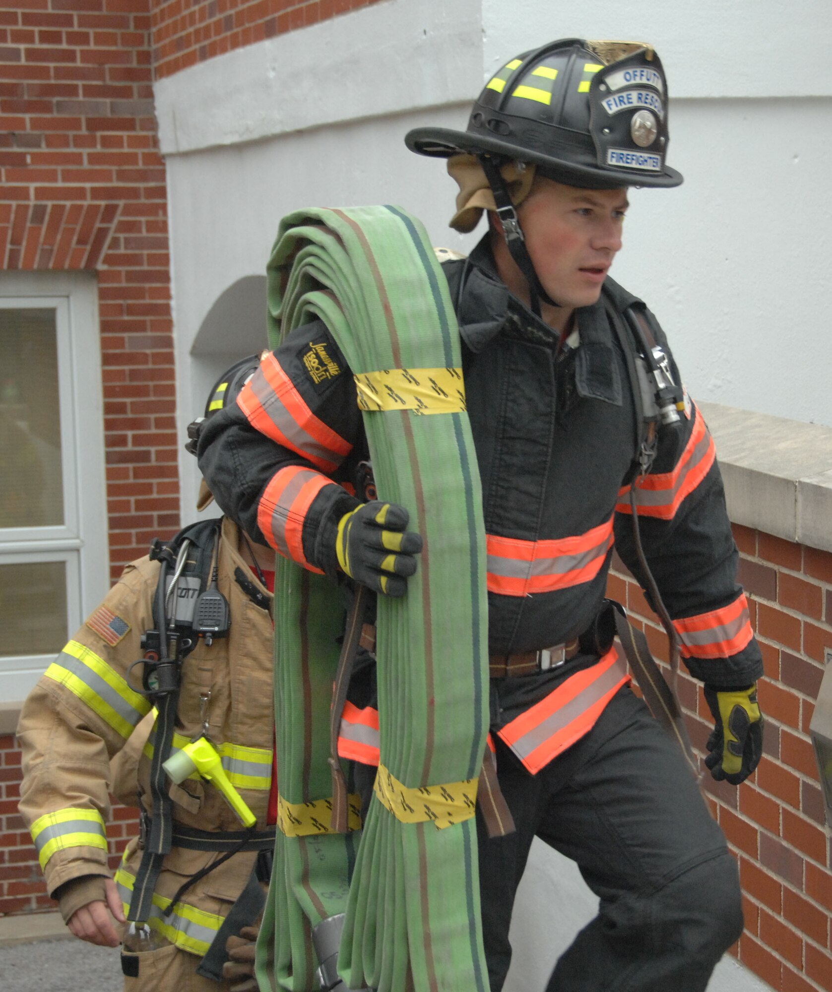 Matt Gibbons, Offutt Air Force Base, Nebraska, firefighter, climbs 110 flights of stairs in full-bunker gear during a Sept. 11 ceremony at the 55th Communications Group building. The ceremony was in remembrance of the New York fire fighters who died in the Twin Towers on Sept. 11, 2001. (U.S. Air Force photo by 2nd Lt. Carly A. Costello)