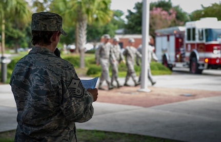 Master Sgt. Jennifer Crerar, 628th Security Forces Squadron first sergeant, delivers a speech during a 9/11 memorial retreat ceremony Sep. 11, 2014, at Joint Base Charleston, S.C. The retreat ceremony was a poignant reminder of the events of 13 years ago, and the continuing efforts today’s military is making against the War on Terrorism. (U.S. Air Force photo/Airman 1st Class Clayton Cupit)