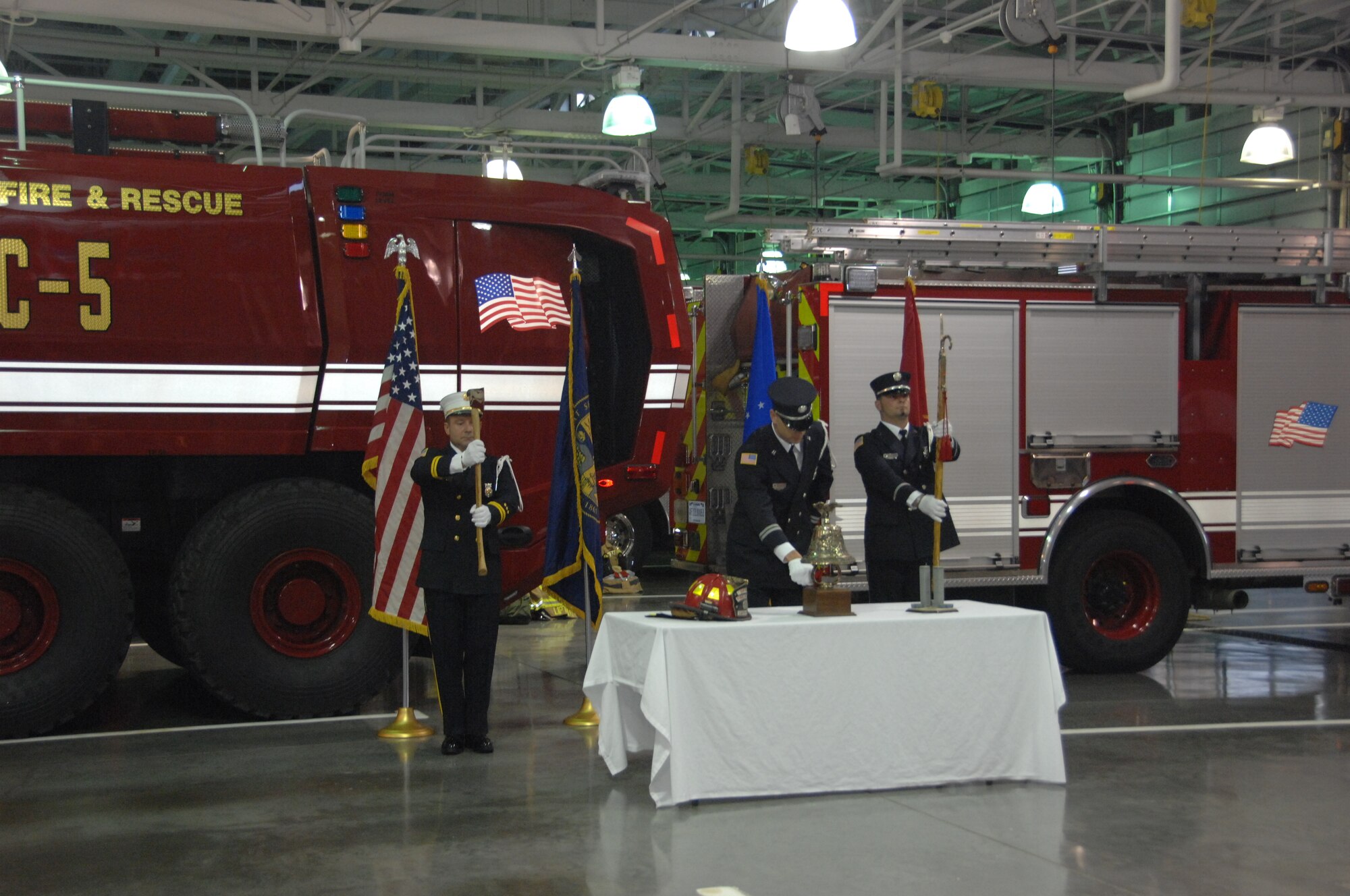 A member of the Offutt Air Force Base Firefighter Ceremonial Guard rings a bell 20 times to signifying a firefighter’s last call during a Sept. 11 ceremony at the Offutt Fire House. The ceremony took place at 7:25 a.m. during the fire department’s roll call. (U.S. Air Force photo by 2nd Lt. Carly A. Costello)