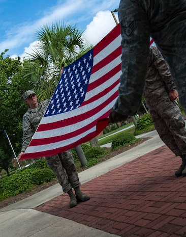 Airmen fold the American flag during a 9/11 memorial retreat ceremony in remembrance of the 9/11 attacks, Sep. 11, 2014, at Joint Base Charleston, S.C. The retreat ceremony was a poignant reminder of the events of 13 years ago, and the continuing efforts today’s military is making against the War on Terrorism. (U.S. Air Force photo/Airman 1st Class Clayton Cupit)