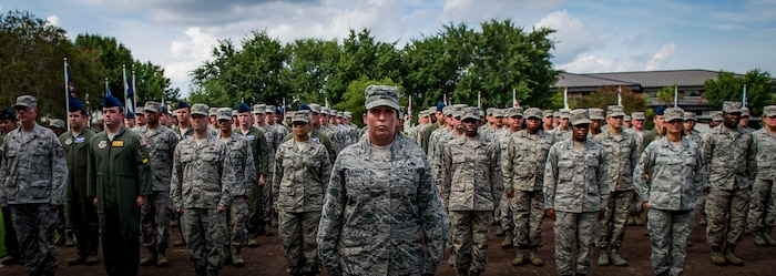 Joint Base Charleston Airmen stand at attention in preparation for a 9/11 memorial retreat ceremony Sep. 11, 2014, at JB Charleston, S.C. The retreat ceremony was a poignant reminder of the events of 13 years ago, and the continuing efforts today’s military is making against the War on Terrorism. (U.S. Air Force photo/Airman 1st Class Clayton Cupit)