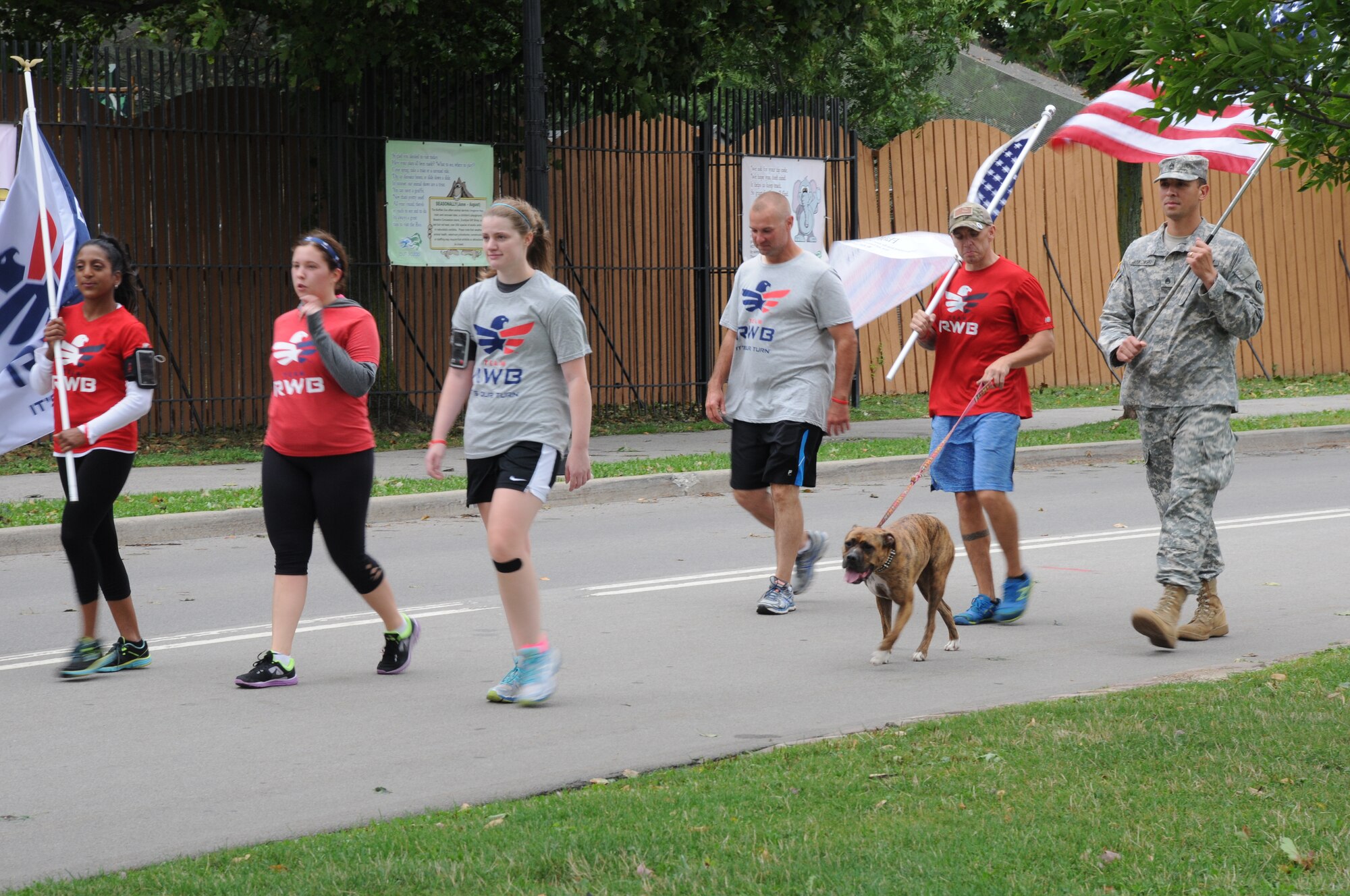 Staff Sgt. Robert Browngriffin, 914th Logistics Readiness Squadron, Mission Support Liaison (second from the right) runs with a members of Team RWB Buffalo at Delaware Park in Buffalo, NY, Seprtember11, 2014. Team RWB was participating in a tribute to the events of 9/11. (U.S. Air Force photo by Staff Sgt. Matthew Burke)