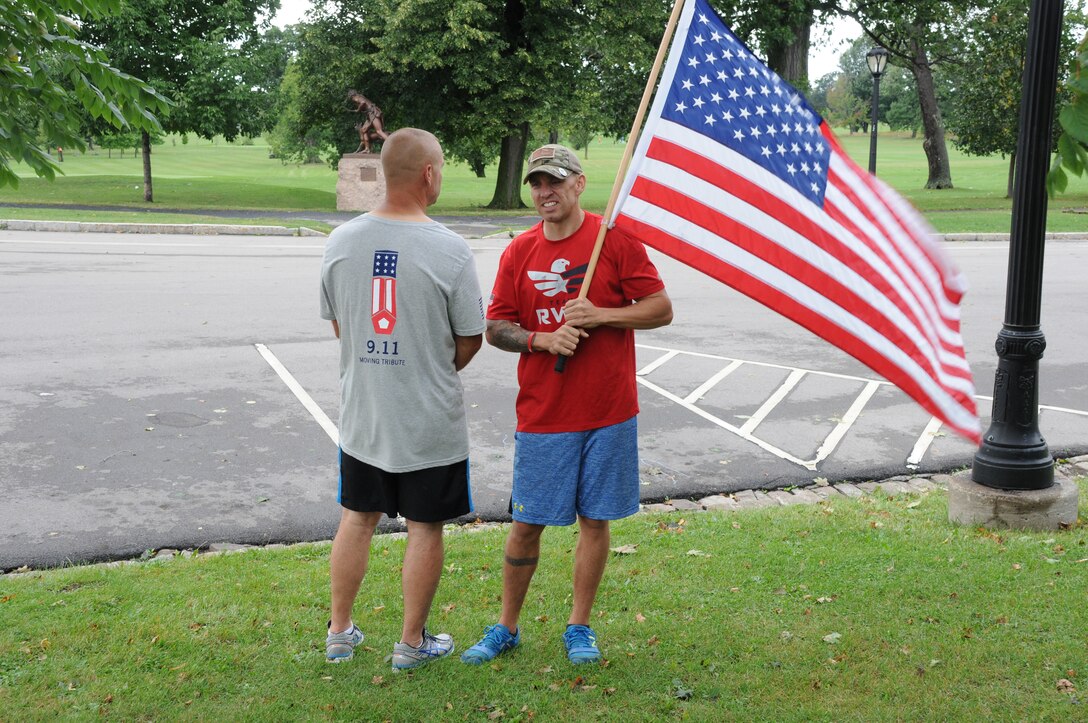 Staff Sgt. Robert Browngriffin, 914th Logistics Readiness Squadron, Mission Support Liaison (right) poses for a picture with a member of Team RWB Buffalo at Delaware Park in Buffalo, NY, Seprtember11, 2014. Team RWB was participating in a tribute to the events of 9/11. (U.S. Air Force photo by Staff Sgt. Matthew Burke)