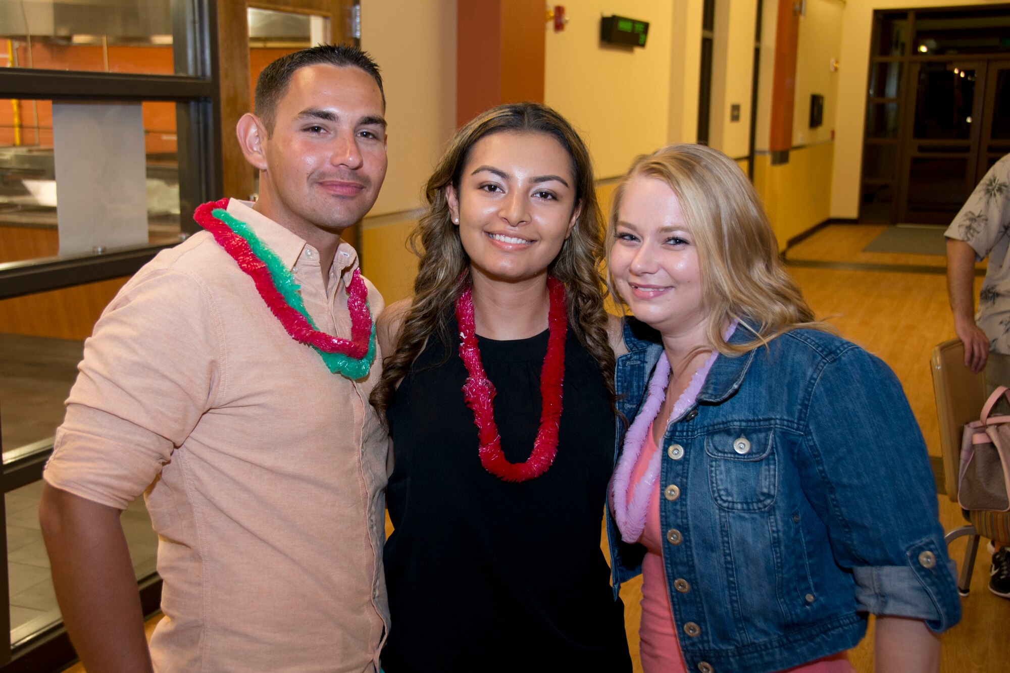 Senior Airman Robert Scalia, Senior Airman Marcela A. Scalia, and Senior Airman Leah M. Feindel pose for a photo during the Luau festivities at Sharkfest 2014. Members of Homestead Air Reserve Base's 482nd Fighter Wing, 482nd Maintenance Group, and Det 2, 20th Operations Group gathered for a Luau themed Sharkfest 2014 at the Community Activity Center here 6 Sept. (U.S. Air Force photo by Senior Airman Nicholas Caceres)
