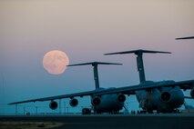 The supermoon rises over the flightline Sept. 8, 2014, at Travis Air Force Base, Calif. Supermoons are full moons that coincide with "lunar perigee," when the moon's orbit brings it closest to Earth. This moon appears bigger and brighter than a typical full moon. The lunar event on this particular night was unique in its own way as it coincided with the Harvest Moon. (U.S. Air Force photo by Heide Couch)