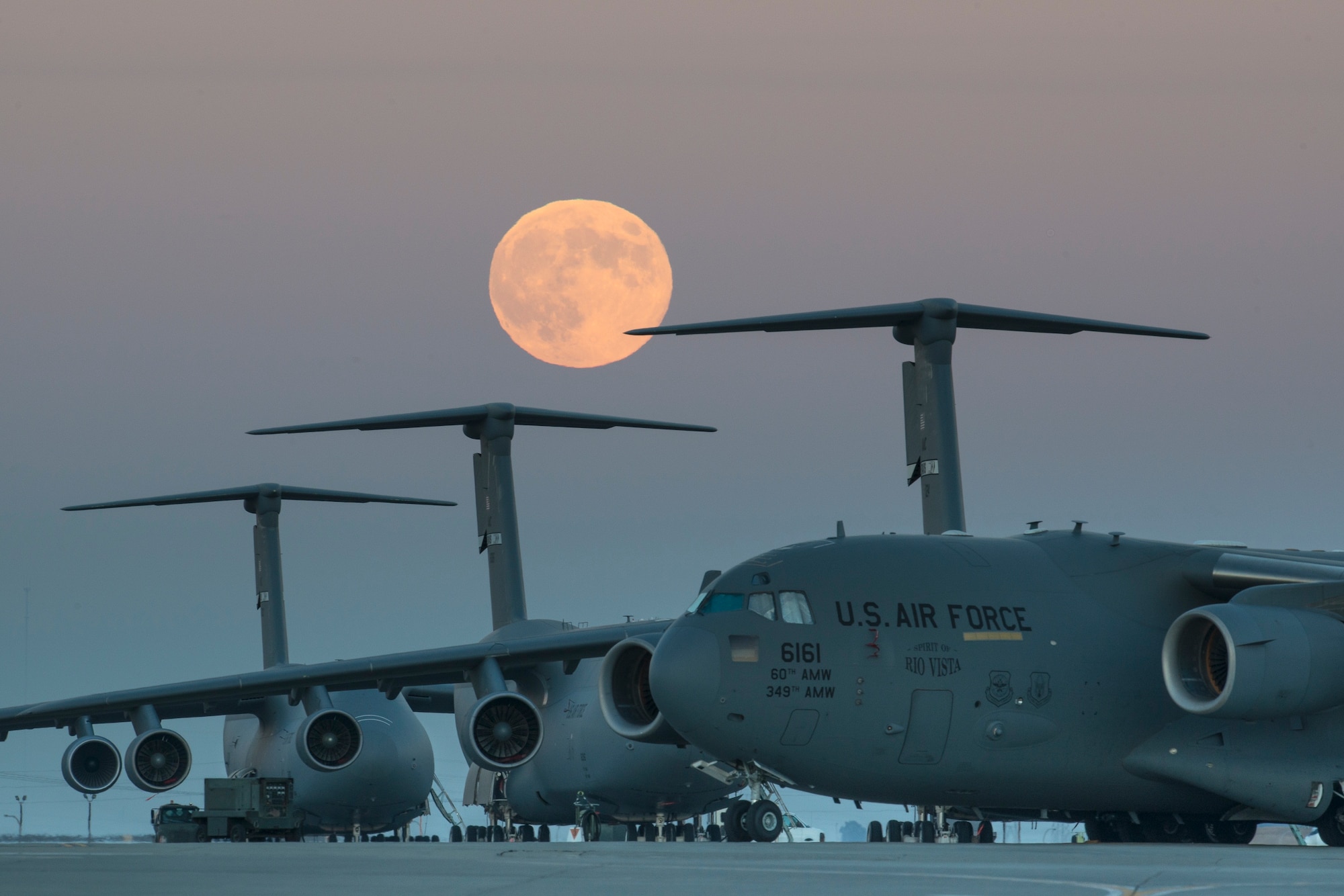 The supermoon rises over the flightline Sept. 8, 2014, at Travis Air Force Base, Calif. Supermoons are full moons that coincide with "lunar perigee," when the moon's orbit brings it closest to Earth. This moon appears bigger and brighter than a typical full moon. The lunar event on this particular night was unique in its own way as it coincided with the Harvest Moon. (U.S. Air Force photo by Heide Couch)