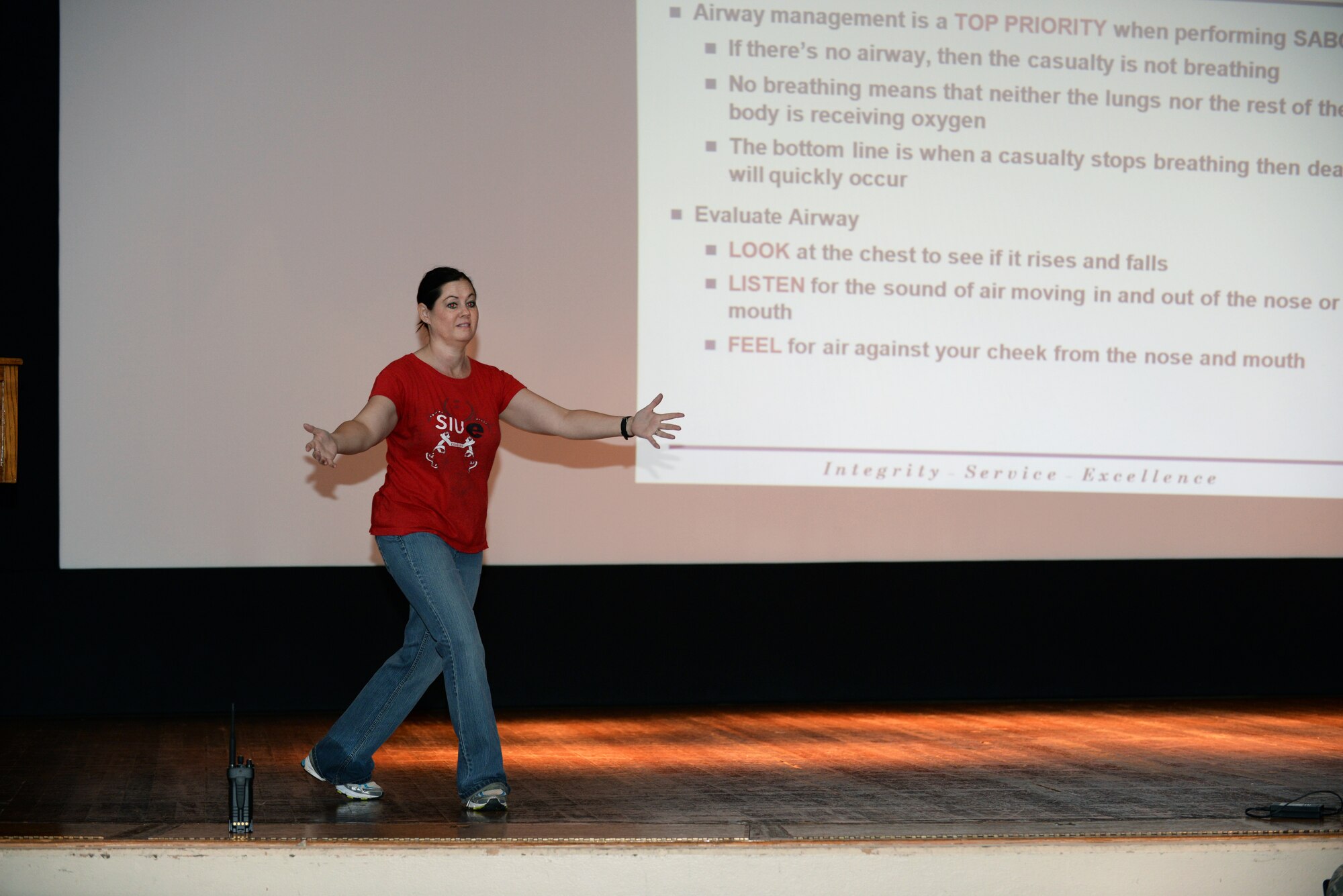 Tonya Hupp, unit program manager for the 375th Communications Squadron, presents the re-cap of what would be performed during the hands-on portion of the Self-Aid & Buddy Care training at the Education Center, Scott Air Force Base, Ill., Sept. 8, 2014. Two groups went through this training in one day, and 150 personnel, through this training, fulfilled their requirement of SABC training to be deployment-ready. (U.S. Air Force photo by Airman 1st Class Erica Crossen)
