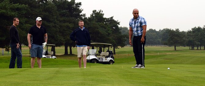Airmen attend a Combined Federal Campaign golf tournament Sept. 11, 2014, at the Breckland Pines Golf Club on RAF Lakenheath, England.  The campaign is an annual federal fundraiser which gives federal employees the opportunity to donate to any of the nonprofit charity organizations registered to the CFC. (U.S. Air Force photo/Airman 1st Class Jonathan Light/Released)