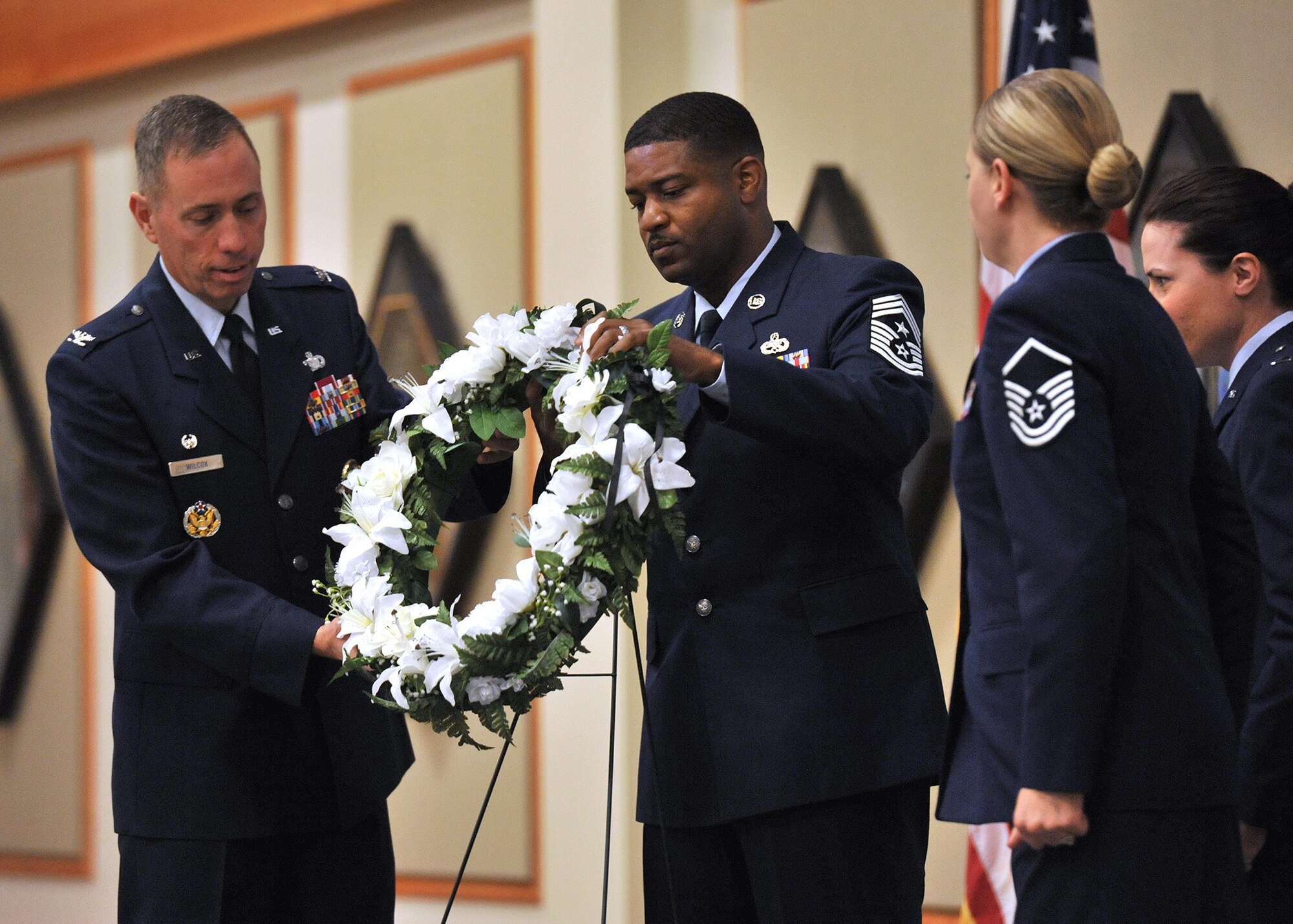 Col. Tom Wilcox, 341st Missile Wing commander, left, and Chief Master Sgt. Phillip Easton, 341st MW command chief, lay a wreath prior to observing a moment of silence for victims of the Sept. 11, 2001 terrorist attacks. The “In Remembrance of 9-11” memorial ceremony was Sept. 11 at the Grizzly Bend. (U.S. Air Force photo/John Turner)