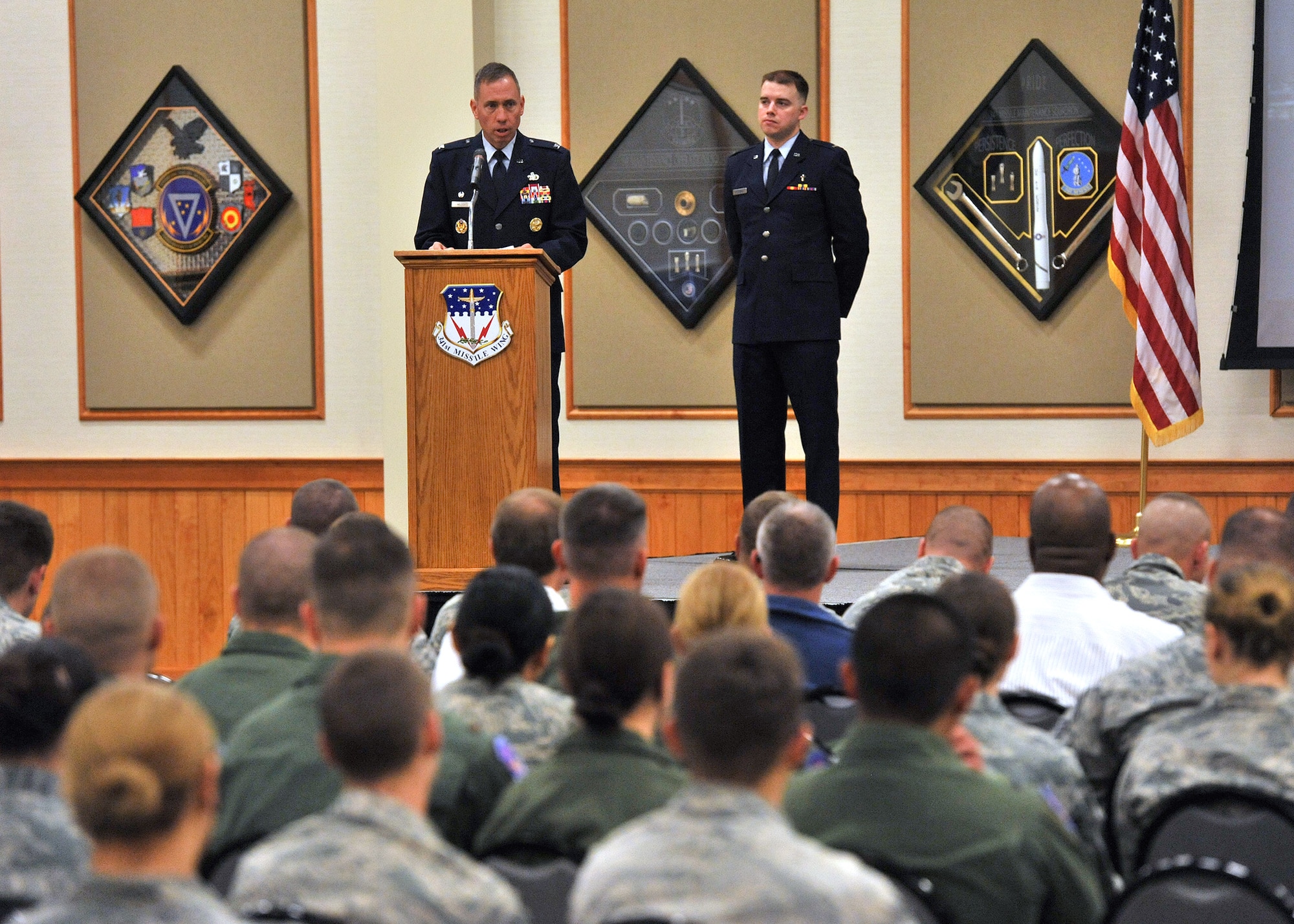 Col. Tom Wilcox, 341st Missile Wing commander, left, speaks to approximately 200 people at the “In Remembrance of 9-11” memorial ceremony Sept. 11, as Chaplain (1st Lt.) John Reutemann, 341st MW chaplain, looks on.  The event was held at the Grizzly Bend. (U.S. Air Force photo/John Turner)