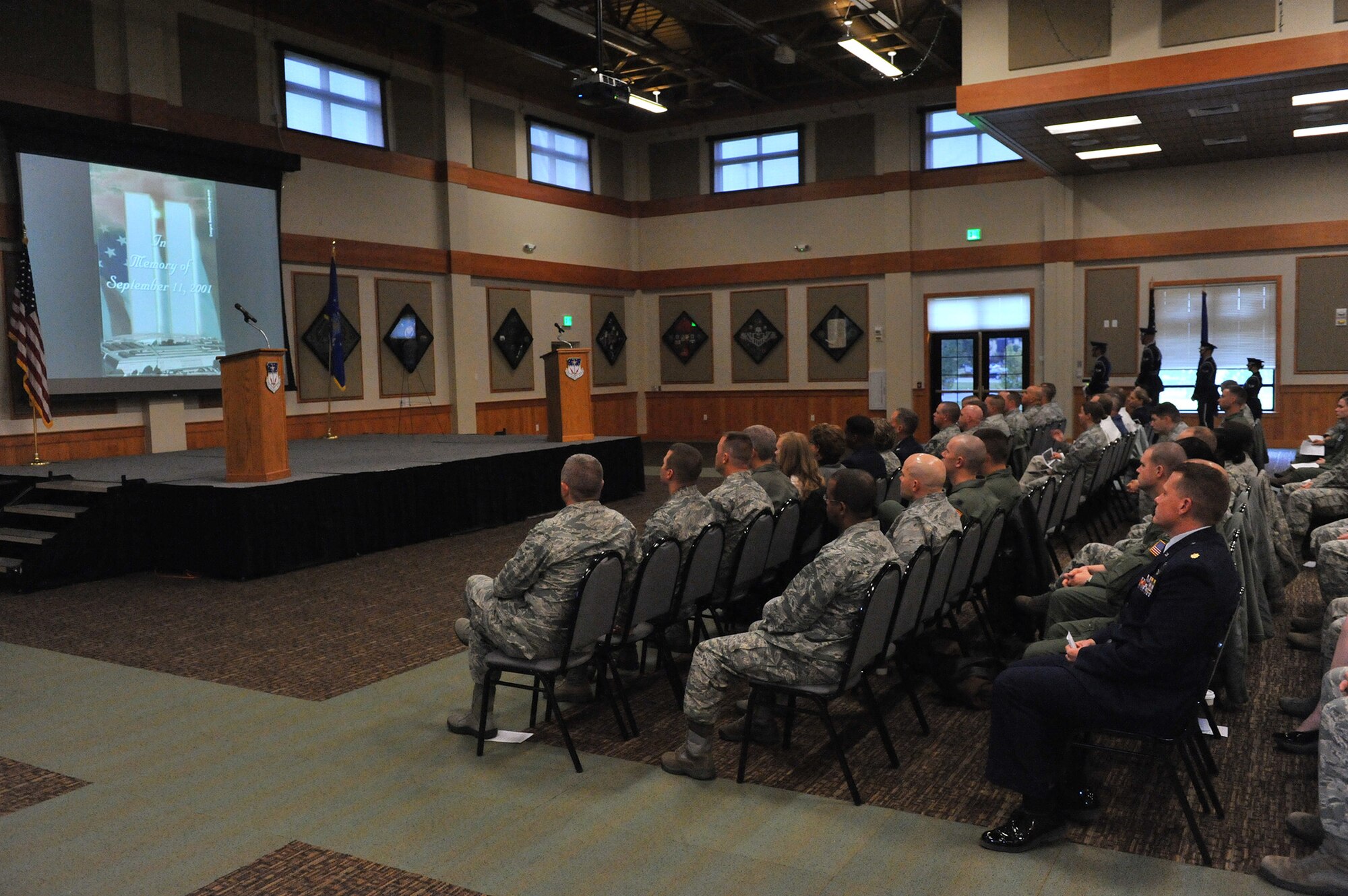 A video reflecting on the events of Sept. 11, 2001, featuring audio of former President George W. Bush’s address to the nation that tragic day, was shown prior to the “In Remembrance of 9-11” memorial ceremony at the Grizzly Bend Sept. 11. Approximately 200 people attended the memorial. (U.S. Air Force photo/John Turner)