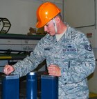 Staff Sgt. James Flanigan, 341st Munitions Squadron technician, installs guide pins into a maintenance platform during a training session at Malmstrom Air Force Base Aug. 21. For Flanigan and his team, job proficiency is a key element to succeeding at the 2014 Global Strike Challenge. (U.S. Air Force photo/Airman 1st Class Collin Schmidt)