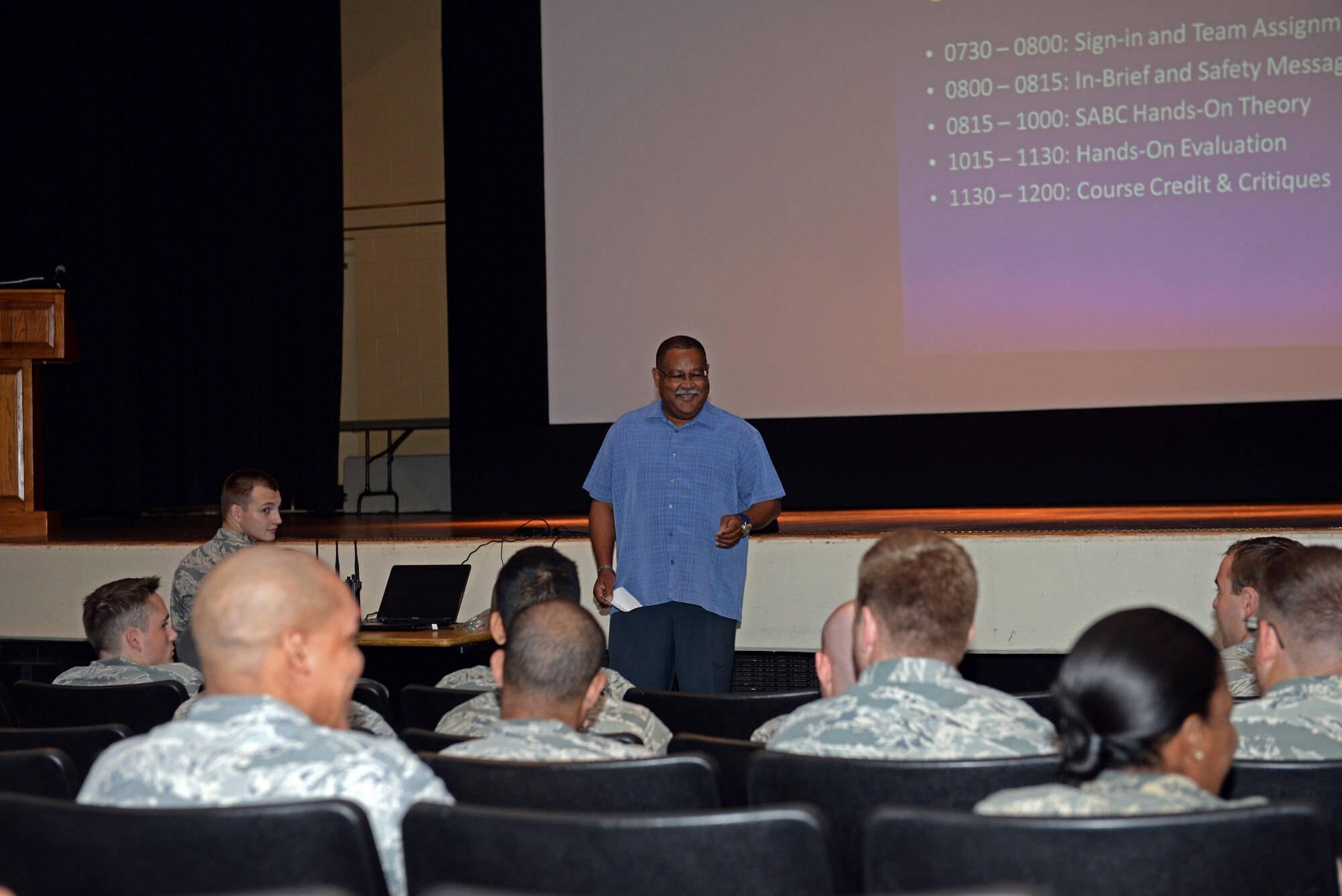 Bob Murray, security manager with the 375th Communications Group, presents a summary of what would be performed during the hands-on portion of the Self-Aid & Buddy Care training at the Education Center, Scott Air Force Base, Ill., Sept. 8, 2014. He shared an a personal instance when he was in need of emergency care, and related the care he received to that of the importance of knowing  SABC skills to potentially save a life. Two groups went through this training in one day, and 150 personnel, through this training, fulfilled their requirement of SABC training to be deployment-ready. (U.S. Air Force photo by Airman 1st Class Erica Crossen)