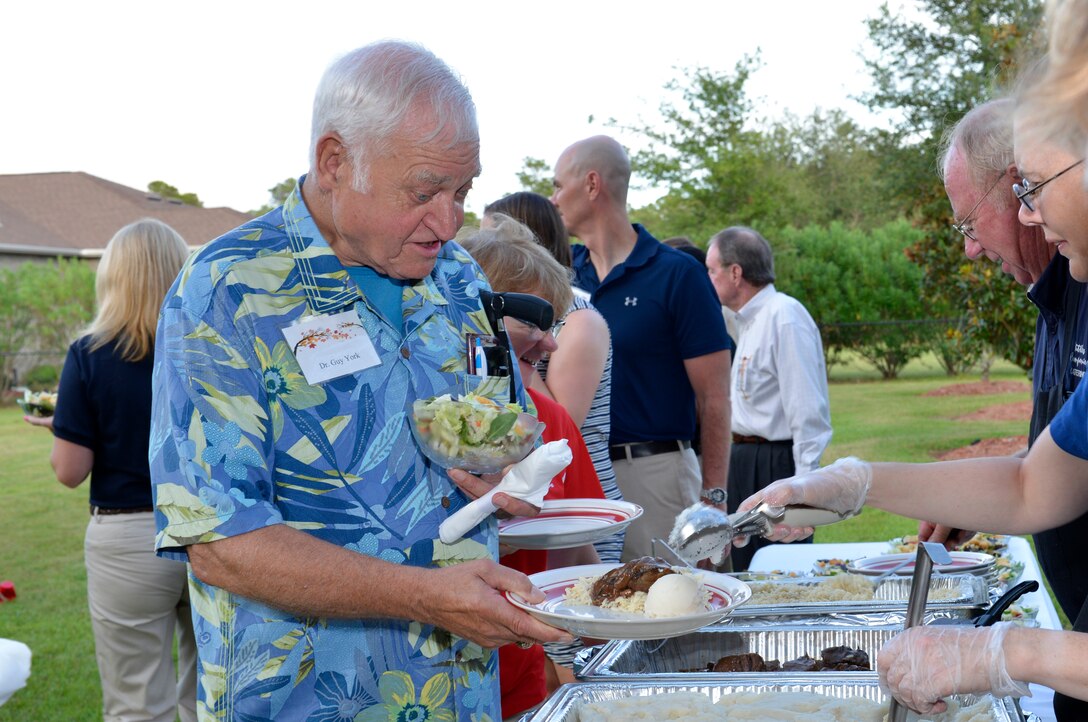 9/9/2014 – TYNDALL AIR FORCE BASE, Fla. – Dr. Guy York of Panama City is served at the Fall Festival Tuesday at the residence of Lt. Gen. William Etter, commander, Continental U.S. North American Aerospace Defense Command Region - 1st Air Force (Air Forces Northern). The event brought local civic leaders as well as leaders from the 325th FW and AFNORTH together for good food and conversation. (U.S. Photo by Master Sgt. Kurt Skoglund/Released)

