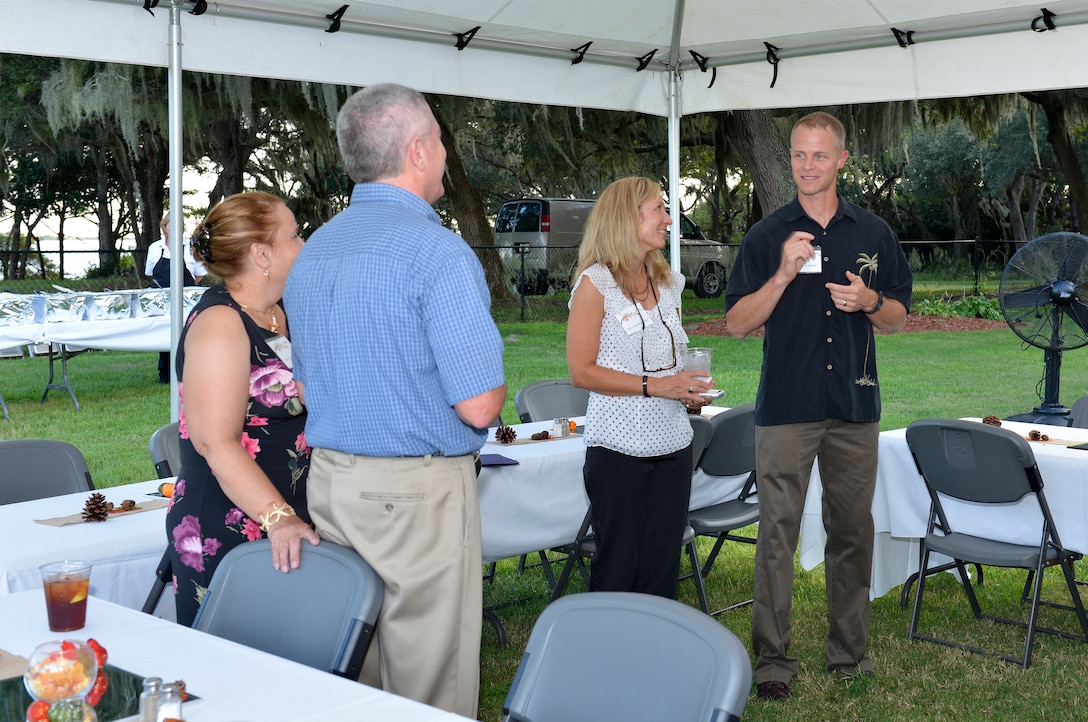 TYNDALL AIR FORCE BASE, Fla. – Col. Derek France left, commander, 325th Fighter Wing and his wife Amanda, center, and his vice commander, Col. Mark O’Laughlin, attend a Fall Festival at the residence of Lt. Gen. William Etter, commander, Continental U.S. North American Aerospace Defense Command Region - 1st Air Force (Air Forces Northern). The event brought local civic leaders along with leaders from the 325th FW and AFNORTH together for good food and conversation. (U.S. Photo by Master Sgt. Kurt Skoglund/Released)