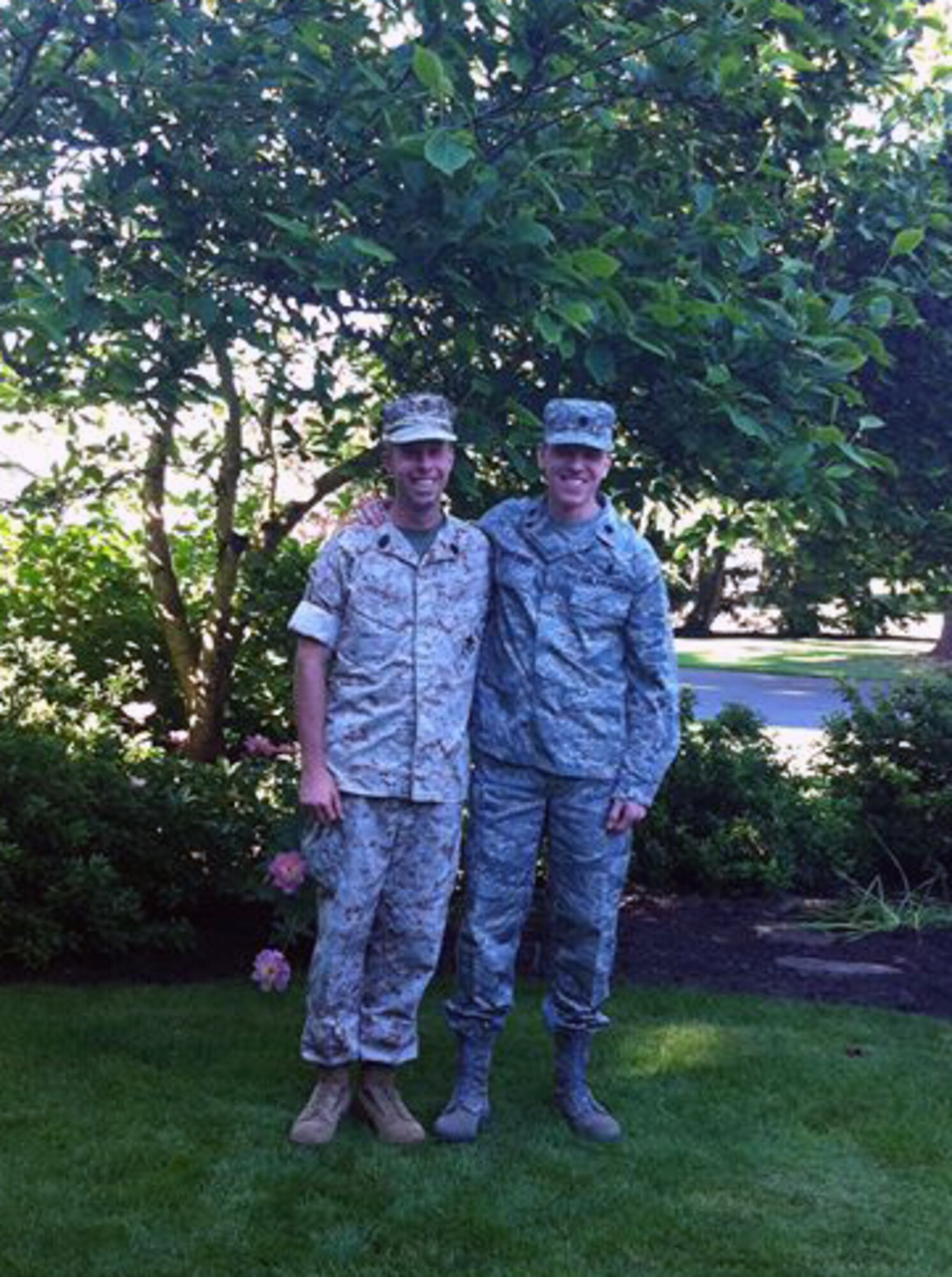 Lt. Col. Trevor Wentlandt, Aerospace Data Facility-Colorado Mission Operations Squadron commander, and his brother, U.S. Marine Corps Master Sgt. Brady Wentlandt, Combat Logistics Battalion 453 supply officer, both proudly serve their country side by side. After 20 years of being apart, the Wentlandts are now both stationed at Buckley Air Force Base, Colo. (U.S. Air Force photo by Airman 1st Class Samantha Saulsbury/Released) 