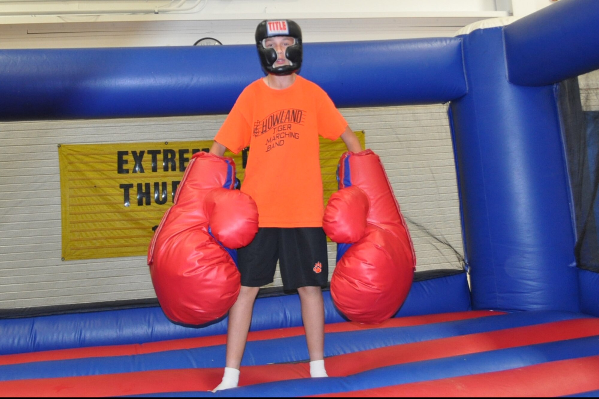 YOUNGSTOWN AIR RESERVE STATION, Ohio – A YARS teen does his best Rocky Balboa impression while preparing to participate in a Bouncy Boxing session at the Fitness Center here during the 2013 YARS Annual Teen Lock-In.  The upcoming 4th YARS Annual Teen Lock-in is scheduled to take place here, 9am until 8pm, Saturday Oct. 11, 2014. See story to left for more event information. Courtesy Photo.