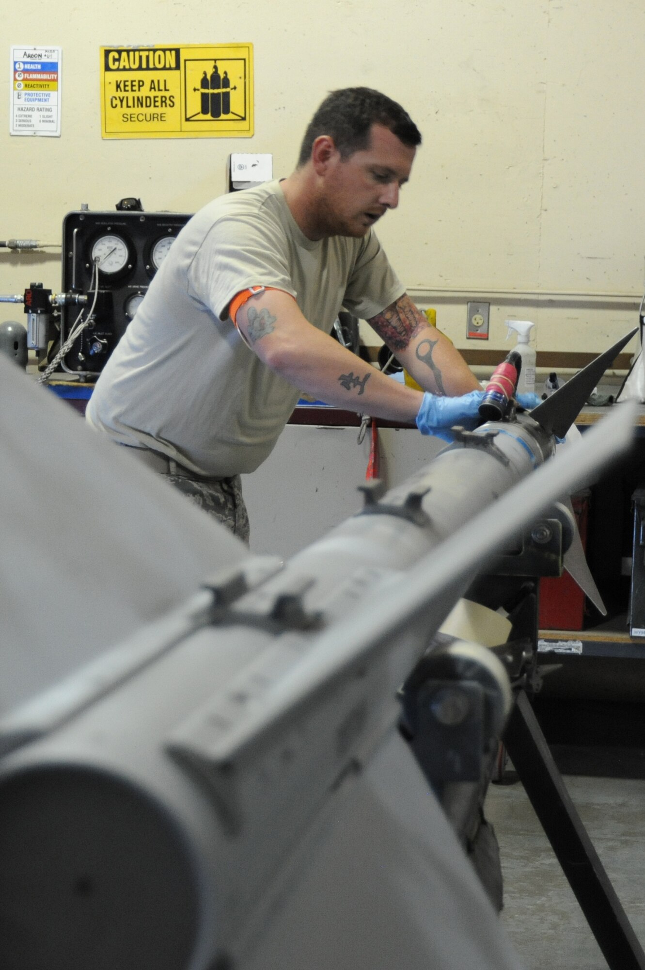 Senior Airman Christopher Bolling, 56th EMS precision-guided munitions team member, performs a periodic inspection of a captive air missile 9 M. All conventional air-to-air and air-to-ground munitions are periodically inspected and tested to ensure serviceability. (U.S. Air Force photo/Airman 1st Class James Hensley)
